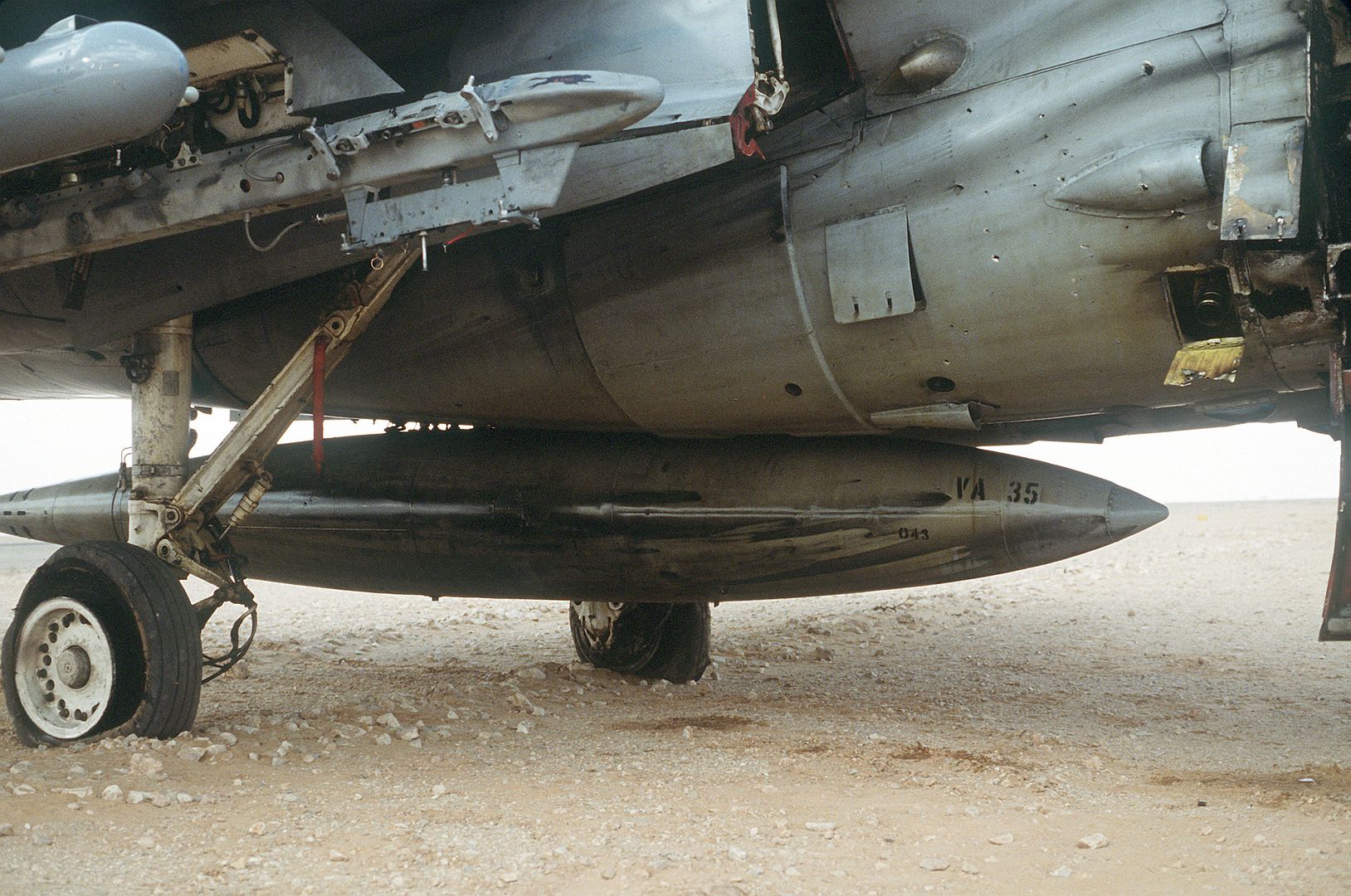 A 6E Intruder Attack Aircraft From Attack Squadron 35 Deployed From The Aircraft Carrier USS SARATOGA Shows Battle Damage From A Mission At The Start Of Operation Desert Storm 1