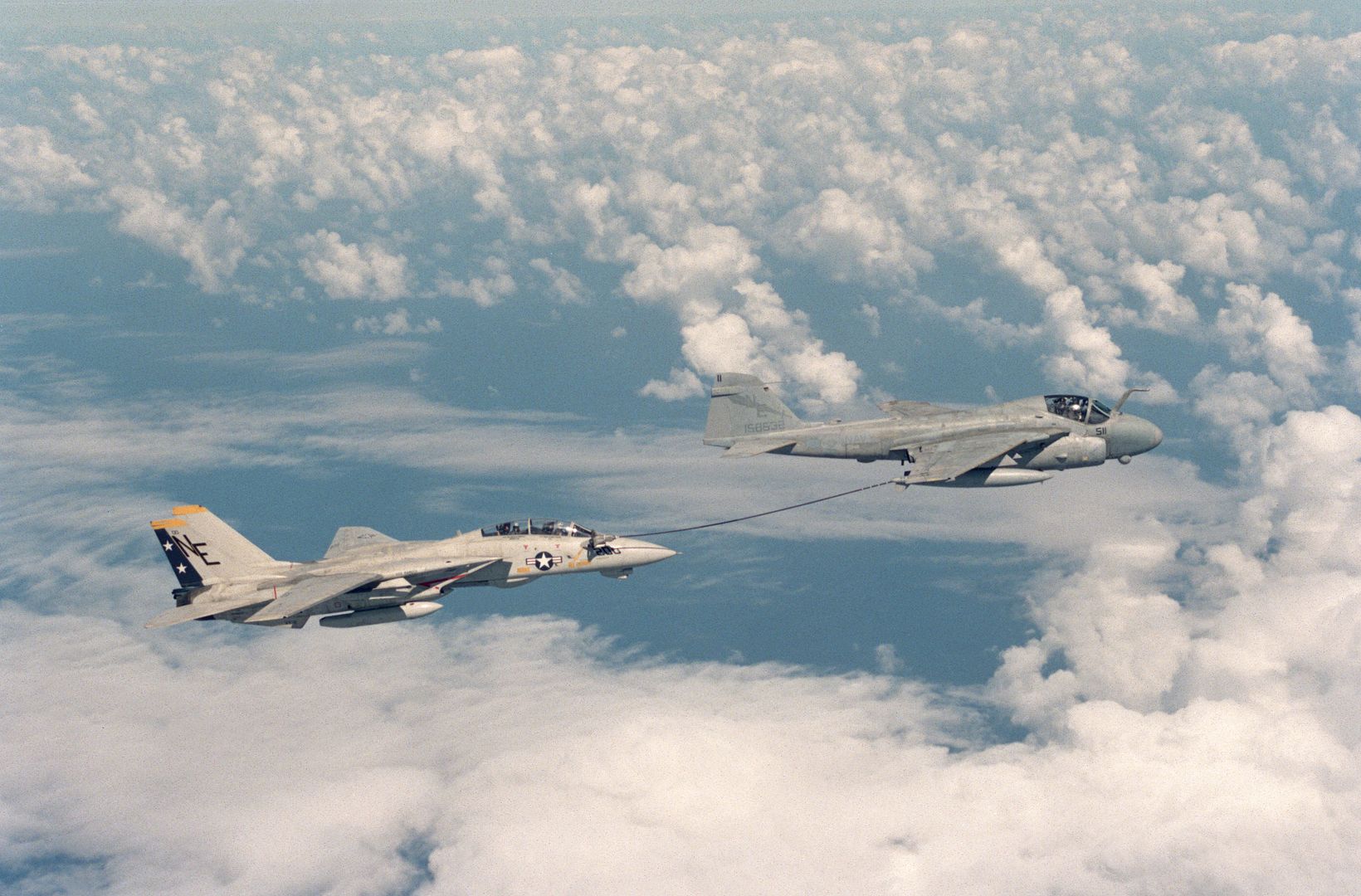 A Fighter Squadron 2 F 14A Tomcat Aircraft Takes On Fuel From An A 6E Intruder Aircraft Equipped With A Buddy Refueling Tank During A Flight Off Of The Aircraft Carrier USS RANGER