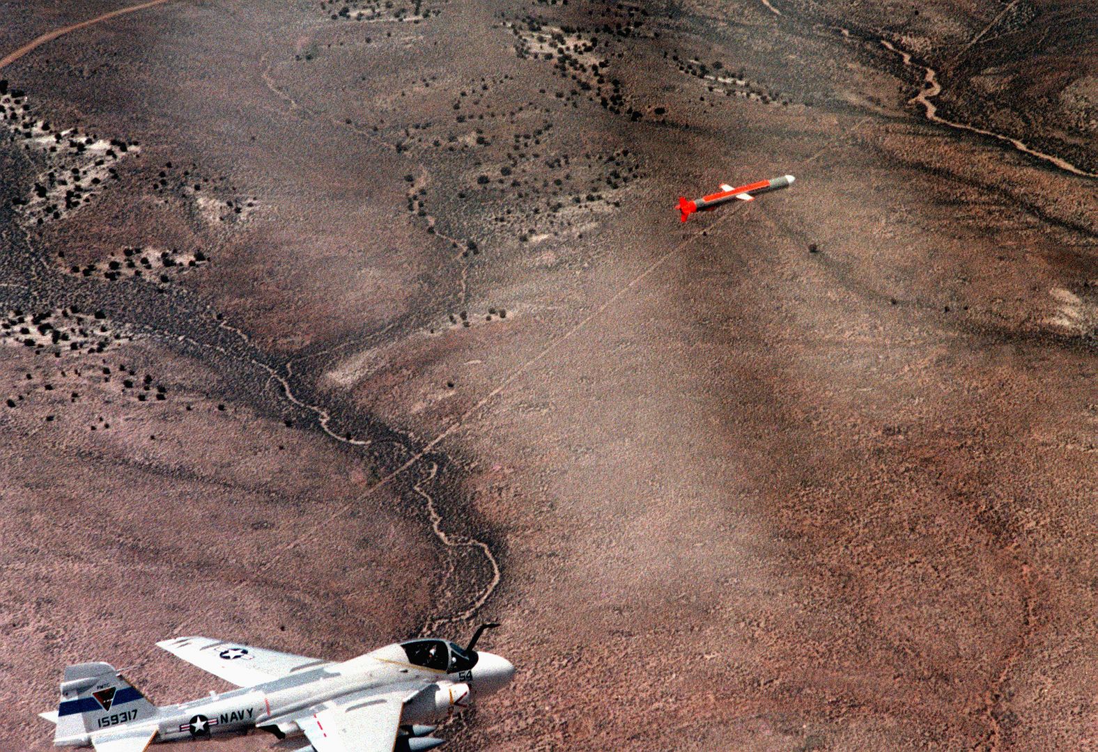 A Tomahawk Cruise Missile Launched From The Nuclear Powered Attack Submarine USS LA JOLLA Is Followed By An A 6 Intruder Aircraft As It Travels Toward Its Target On The Tonapah Test Range In Nevada 1