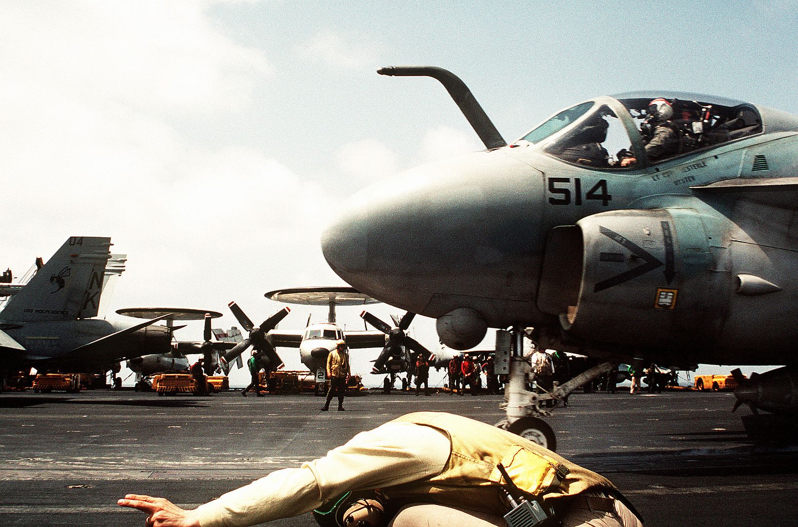 A Catapult Officer Signals For The Launch Of An Attack Squadron 196 A 6E Intruder Aircraft On The Flight Deck Of The Aircraft Carrier USS INDEPENDENCE During Operation Desert Shield