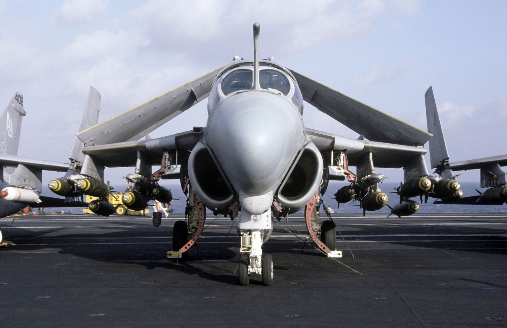 A Front View Of An A 6E Intruder Aircraft Armed With Mark 82 500 Pound Bombs Parked On The Flight Deck Of The Nuclear Powered Aircraft Carrier USS NIMITZ