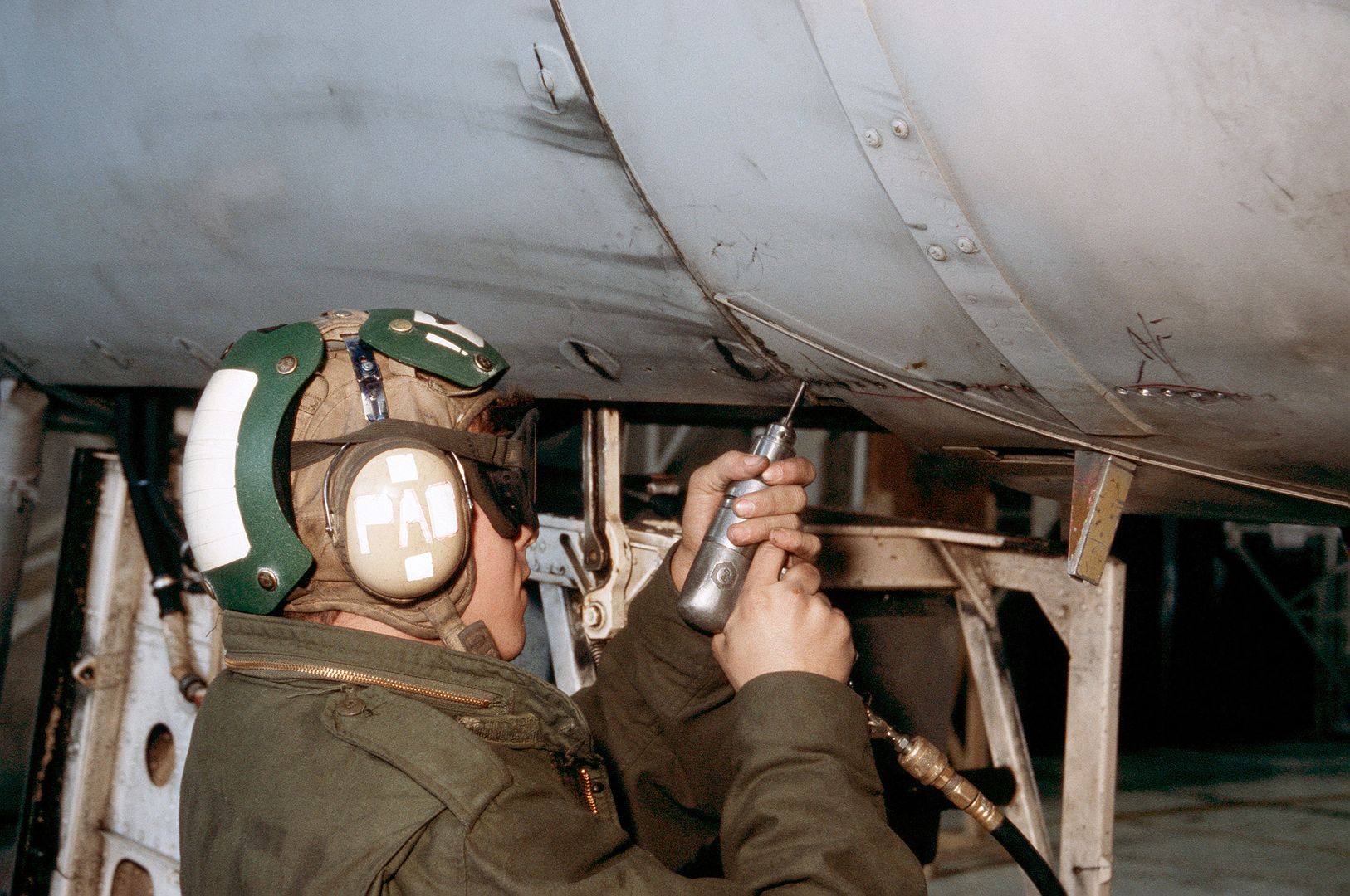 A Maintenance Crewman Uses An Air Wrench To Tighten A Panel On An A 6E Intruder Aircraft From Attack Squadron 35 As The Squadron Prepares To Deploy To The Western Pacific Aboard The Nuclear Powered Aircraft Carrier USS NIMITZ