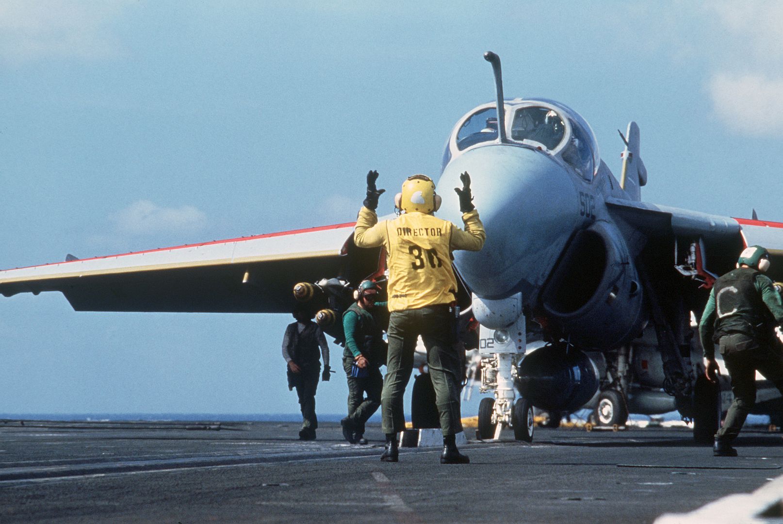 A Plane Director Guides An A 6E Intruder Aircraft Into Position On A Catapult During Flight Operations Aboard The Nuclear Powered Aircraft Carrier USS ENTERPRISE 
