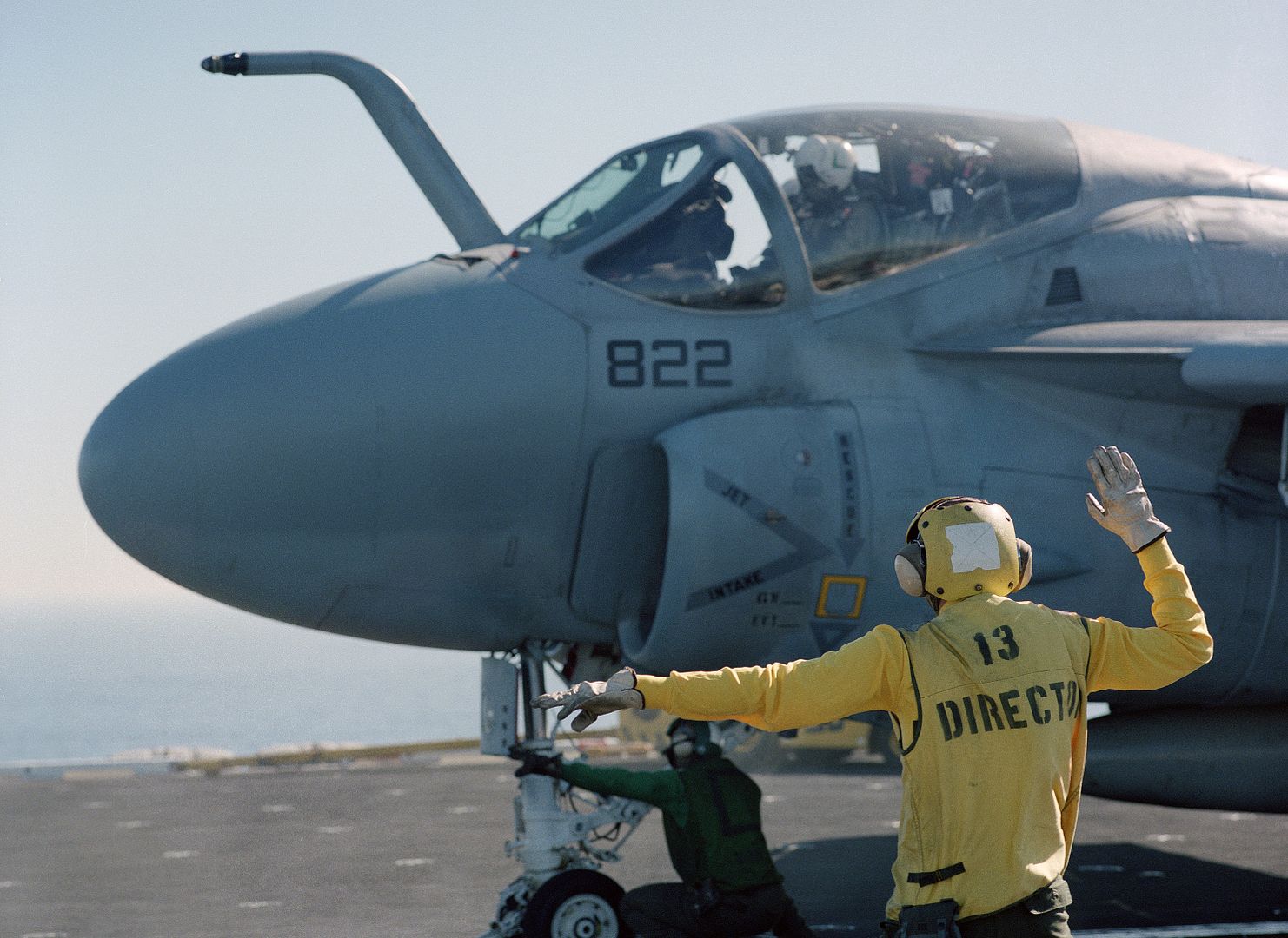 A Plane Director Signals To An A 6E Intruder Aircraft On A Catapult During Flight Operations Aboard The Nuclear Powered Aircraft Carrier USS CARL VINSON