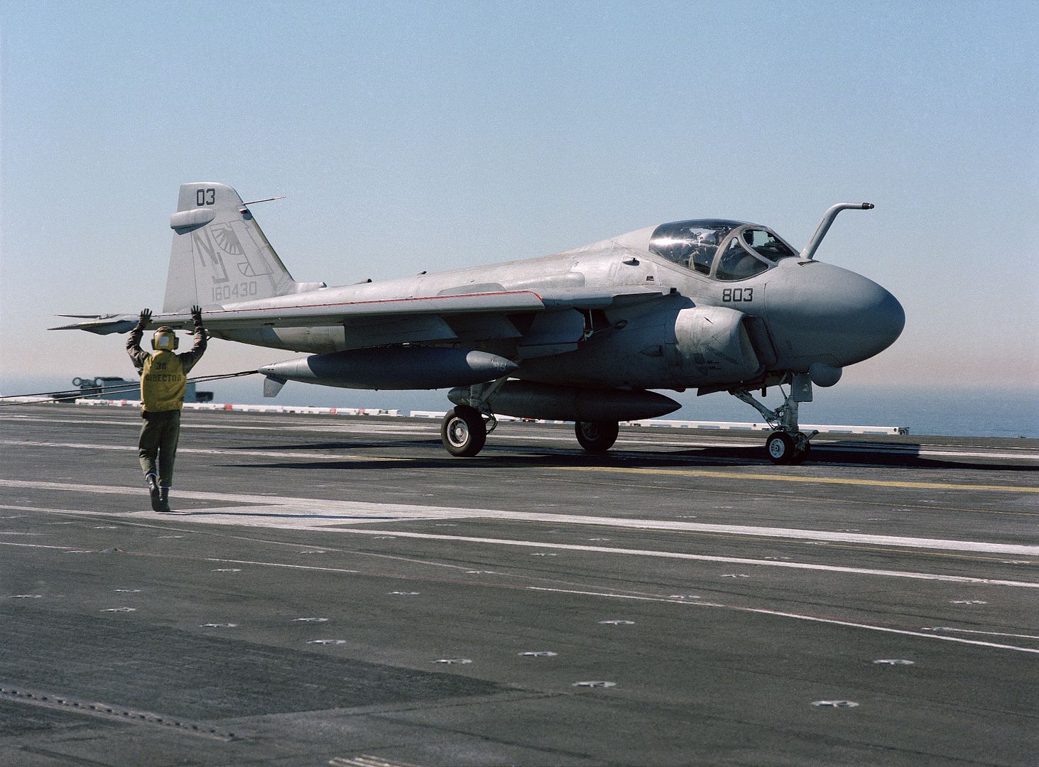 A Plane Director Signals To An A 6E Intruder Aircraft That Has Just Landed During Flight Operations Aboard The Nuclear Powered Aircraft Carrier USS CARL VINSON