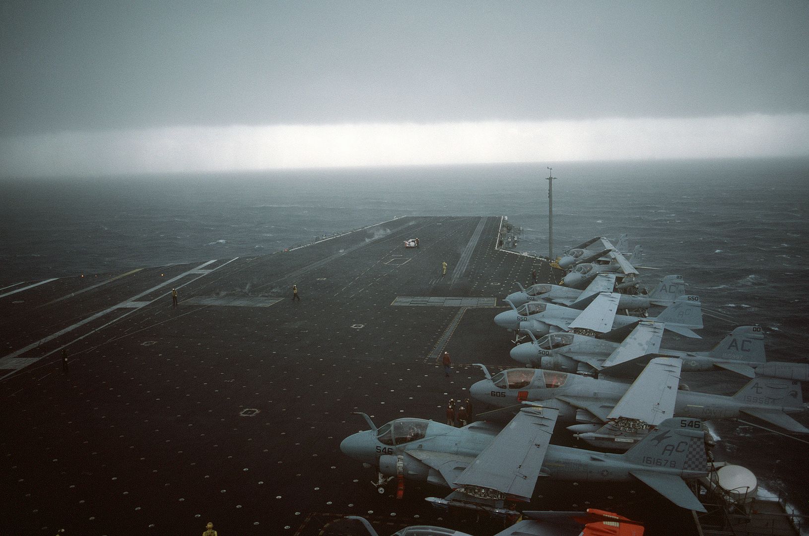  Parked On The Flight Deck Are Several A 6E Intruder Aircraft And An EA 6B Prowler Aircraft