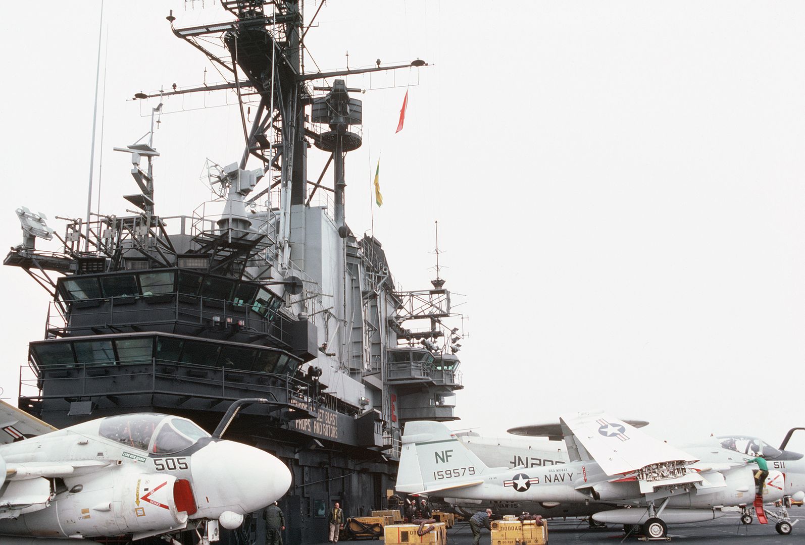 A View Of The Island Aboard The Aircraft Carrier USS MIDWAY Two A 6 Intruder Aircraft And An E 2 Hawkeye Airborne Early Warning Aircraft Background Are Parked On The Deck