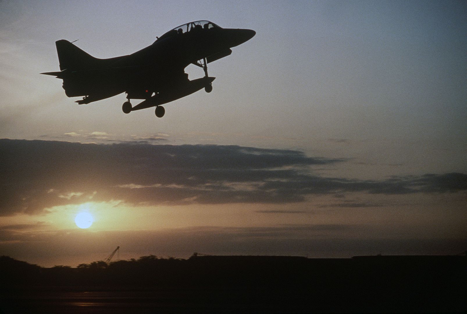 4 Skyhawk Aircraft Takes Off As The Sun Sets During Exercise COPE CANINE 85