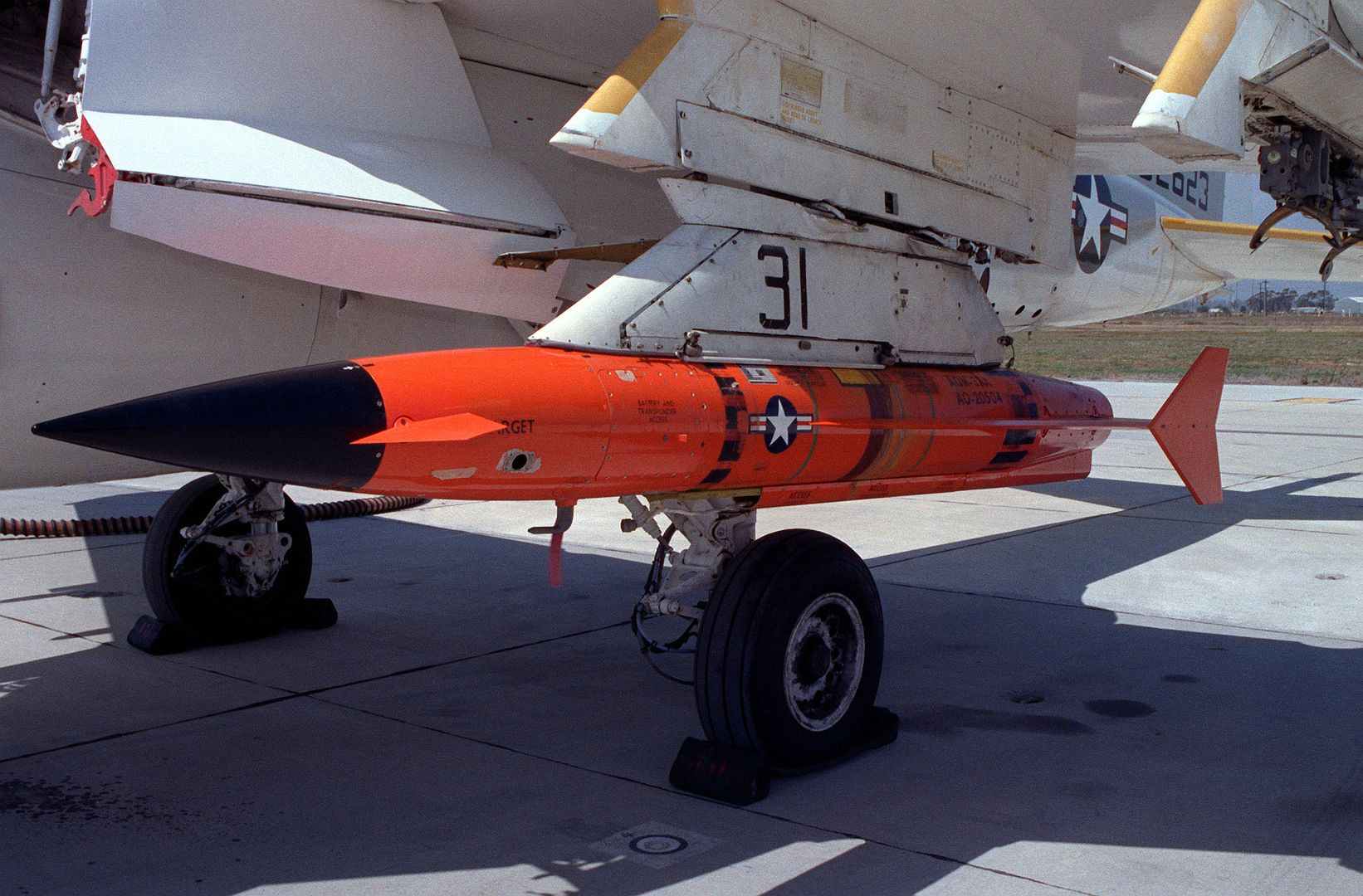 An AQM 37A Target Is Uploaded Onto The Wing Of An A 6E Intruder Aircraft At The Pacific Missile Test Center