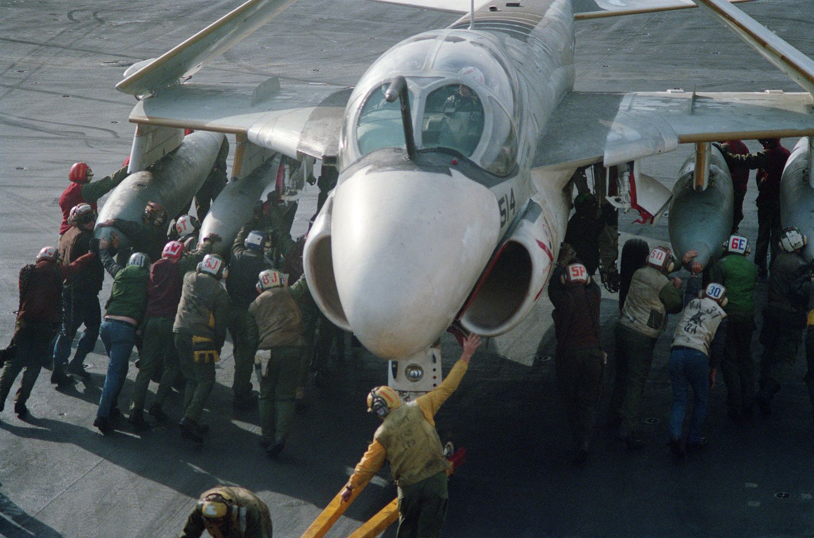 An A 6E Intruder Aircraft Is Maneuvered Into Place On The Flight Deck Of The Aircraft Carrier USS FORRESTAL In The North Atlantic Ocean During Exercise WEST WIND 88