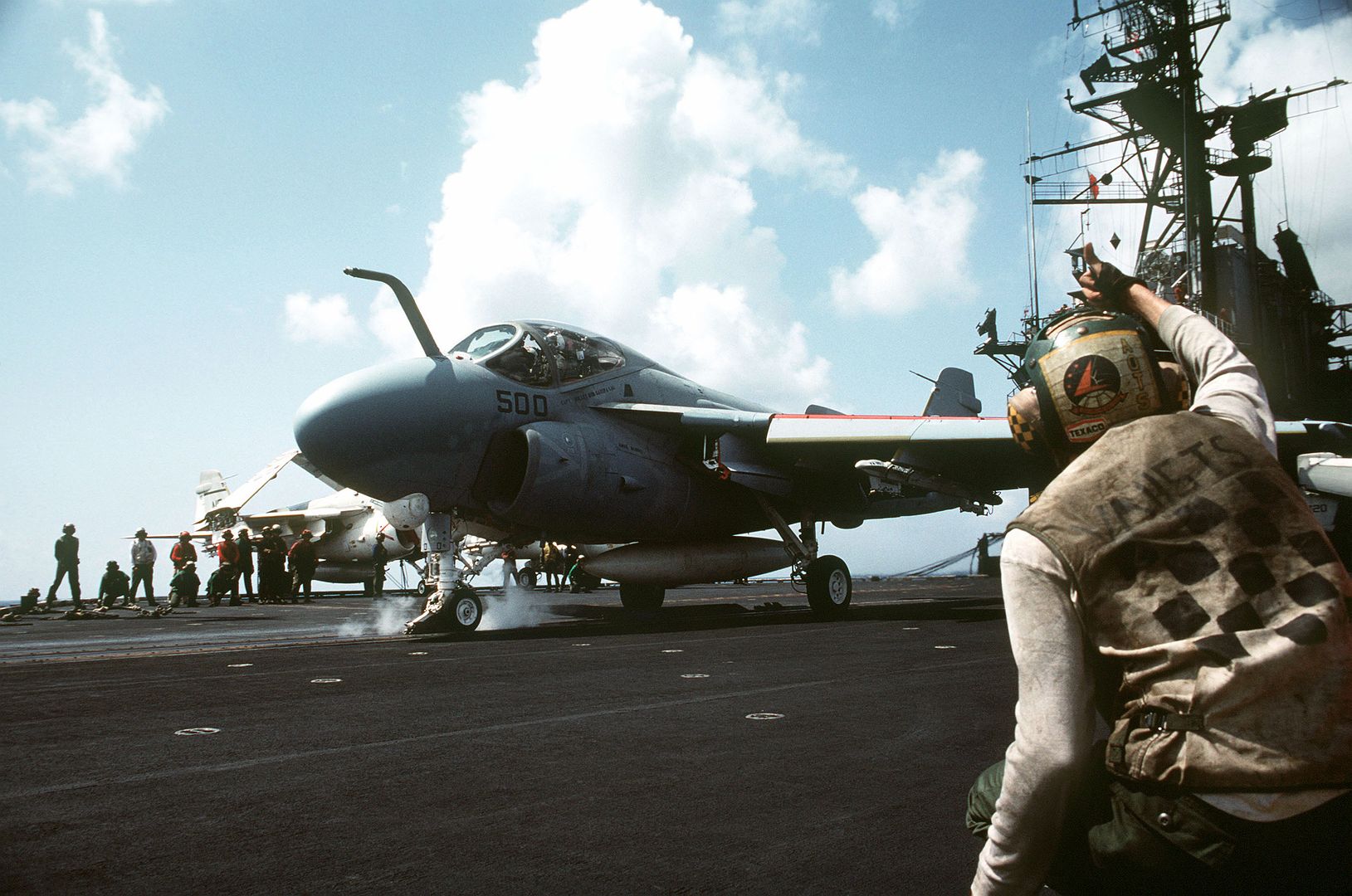 An A 6E Intruder Aircraft Is Prepared For Takeoff From The Flight Deck Of The Aircraft Carrier USS MIDWAY