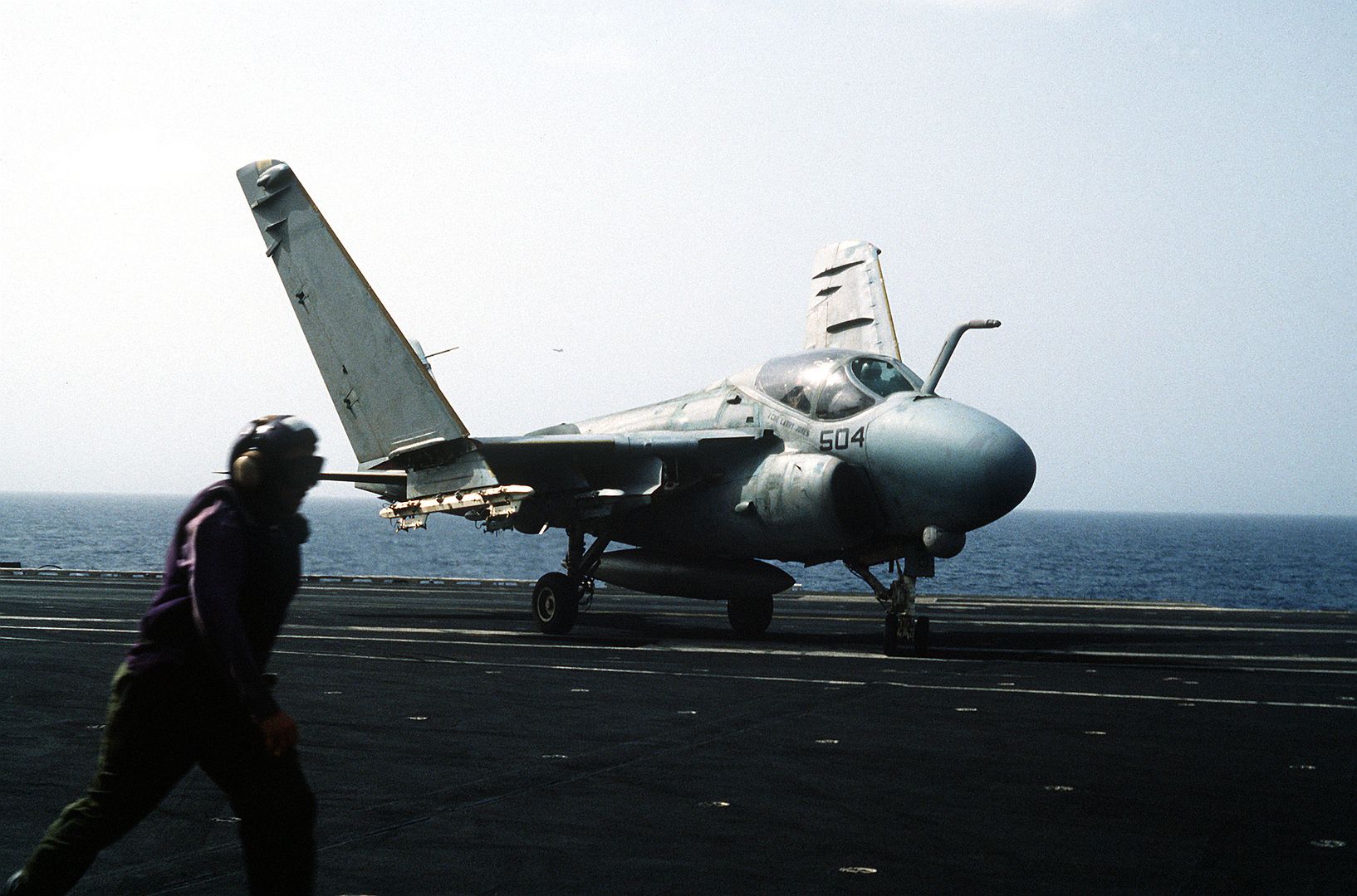 An A 6E Intruder Aircraft Taxis On The Flight Deck Of The Aircraft Carrier USS CORAL SEA Shortly After Landing