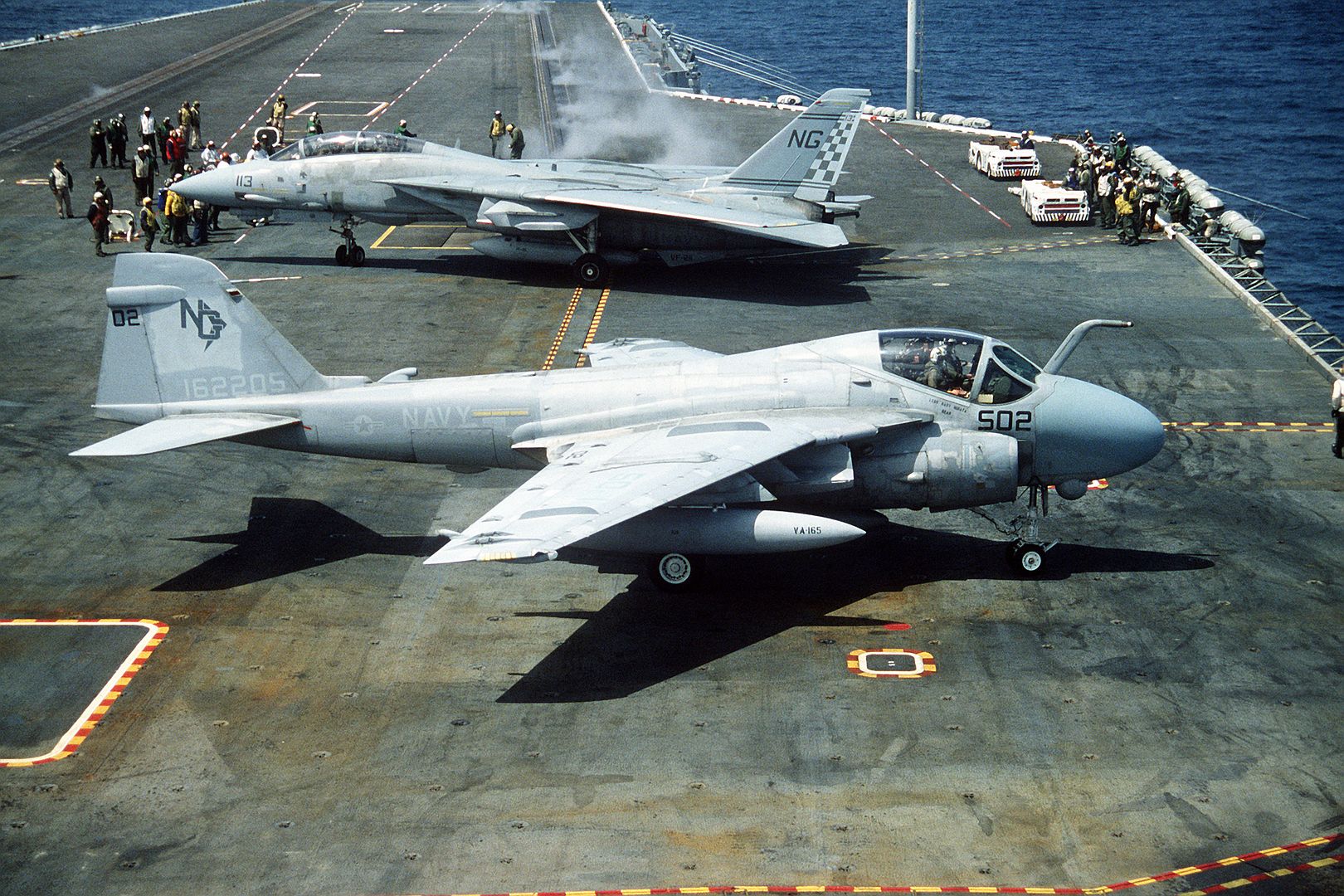 An Attack Squadron 165 A 6E Intruder Aircraft Foreground And A Fighter Squadron 211 F 14A Tomcat Aircraft Background