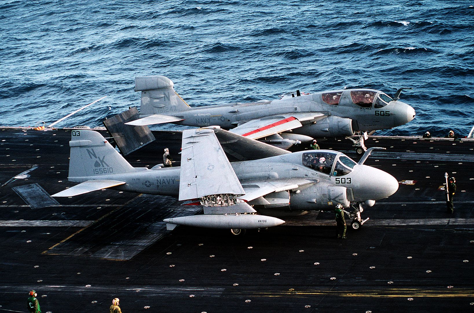 An Attack Squadron 196 A 6E Intruder Aircraft Stands By As An EA 6B Prowler Aircraft Prepares To Launch From The Flight Deck Of The Aircraft Carrier USS CONSTELLATION