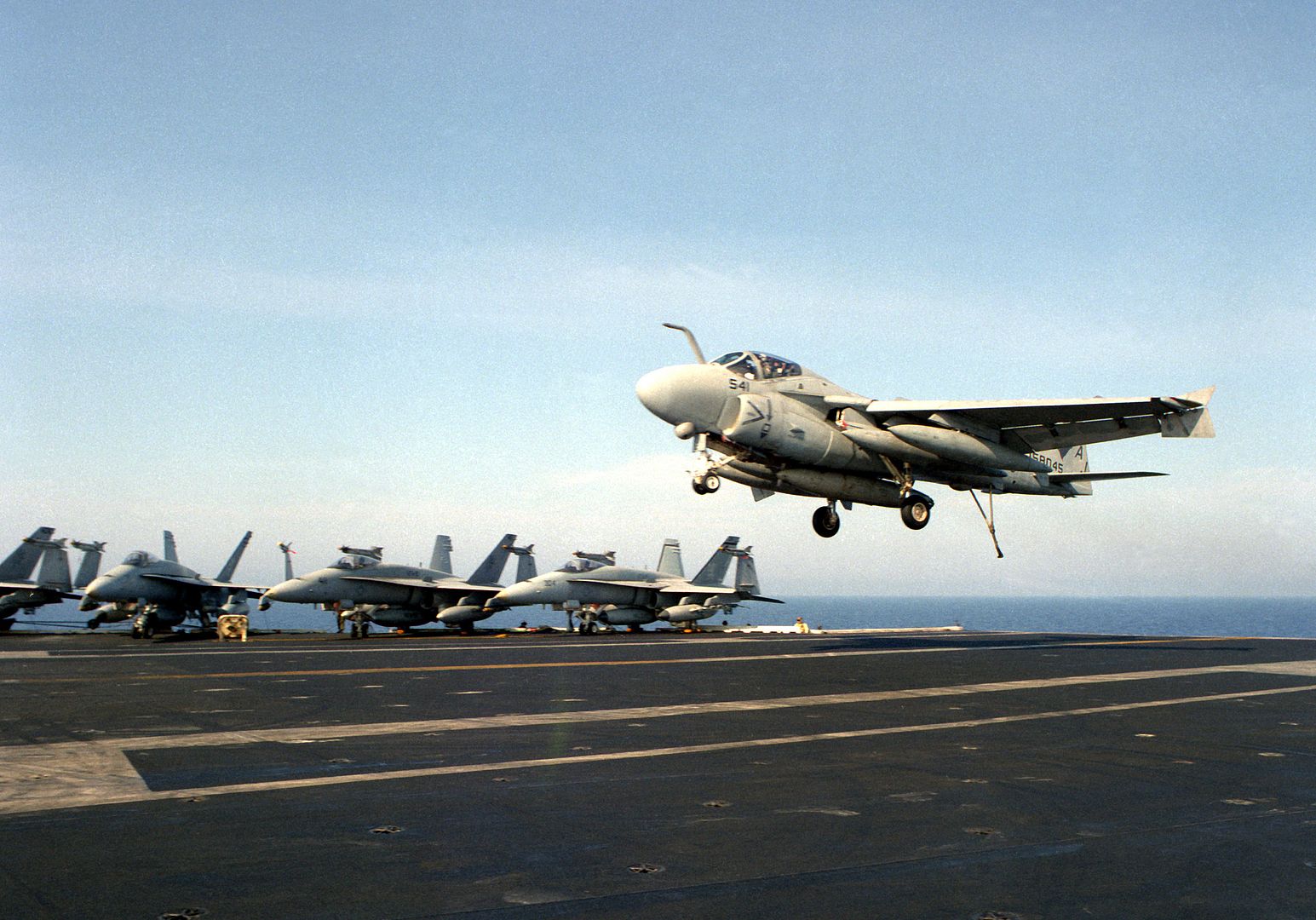An Attack Squadron 36 A 6E Intruder Aircraft Comes In For An Arrested Landing On The Flight Deck Of The Nuclear Powered Aircraft Carrier USS THEODORE ROOSEVELT