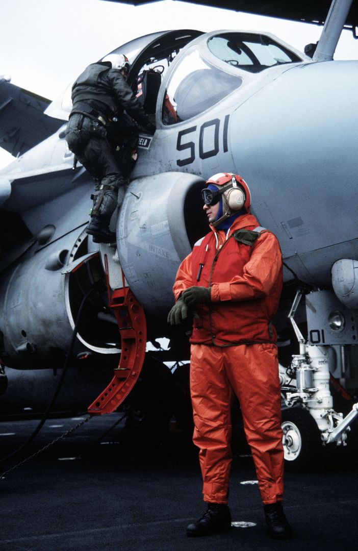 An Attack Squadron 95 Bombardier Navigator Climbs Up Into The Cockpit Of His A 6E Intruder Aircraft On The Flight Deck Of The Nuclear Powered Aircraft Carrier USS ENTERPRISE