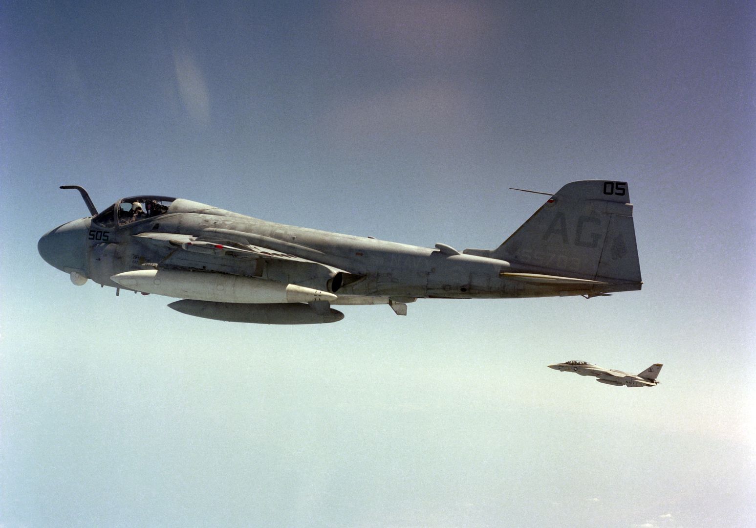 An Air To Air Left Side View Of An A 6E Intruder Aircraft And An F 14A Tomcat Aircraft In Formation
