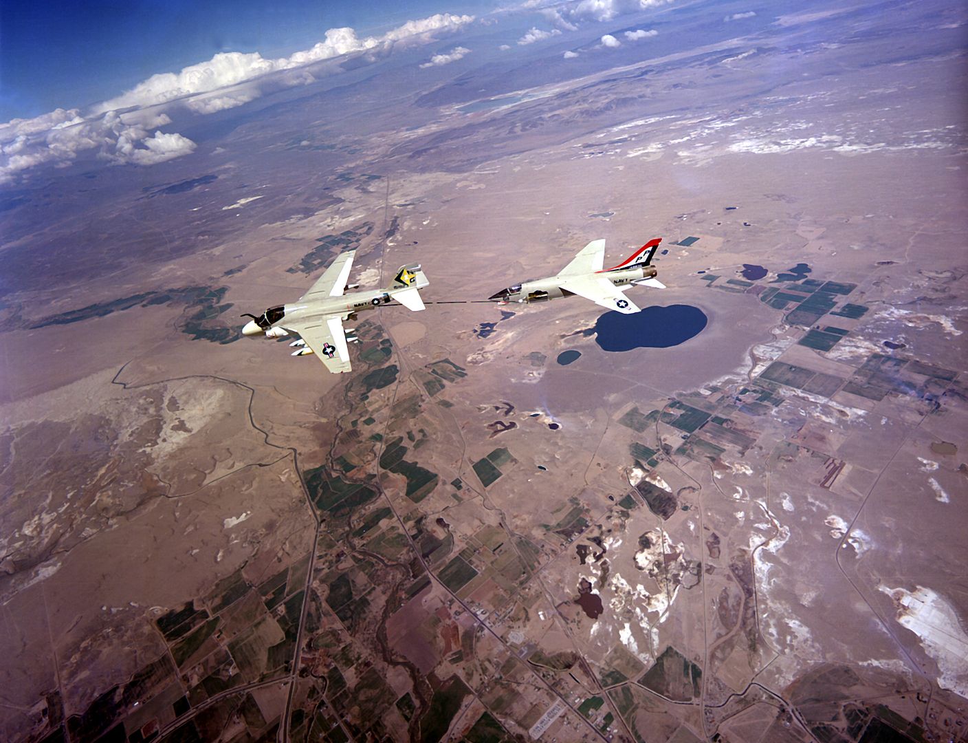 An Air To Air Left Side View Of An F 8 Crusader Aircraft Being Refueled By A KA 6D Intruder Aircraft