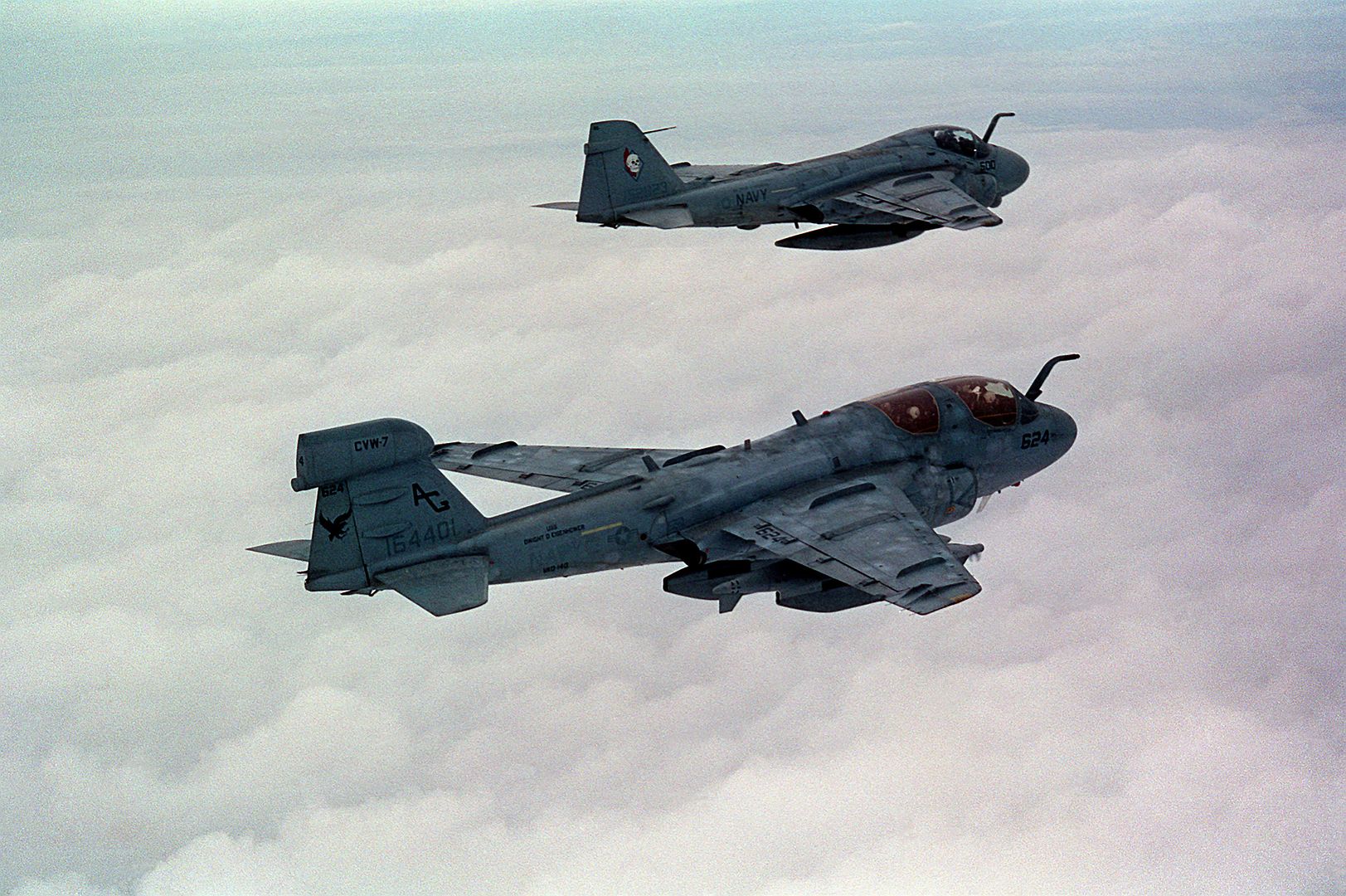 An Air To Air Right Side View Of A Tactical Electronic Warfare Squadron 140 EA 6B Prowler Aircraft Foreground And An A 6E Intruder Aircraft Over The Persian Gulf