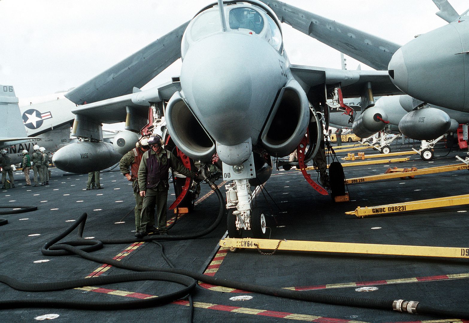 An Aviation Fuels Crew Member Refuels An Attack Squadron 196 A 6E Intruder Aircraft Aboard The Aircraft Carrier USS CONSTELLATION