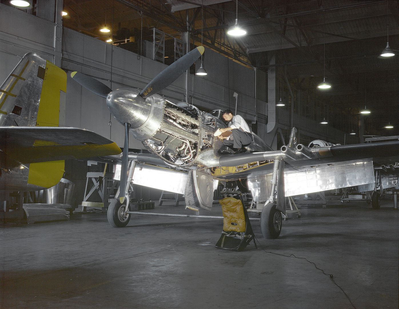 An Inspector OfNorth American Aviation In Inglewood California Looks Over A Mustang Mk I Fighter Destined For The British Royal Air Force In Fall 1942