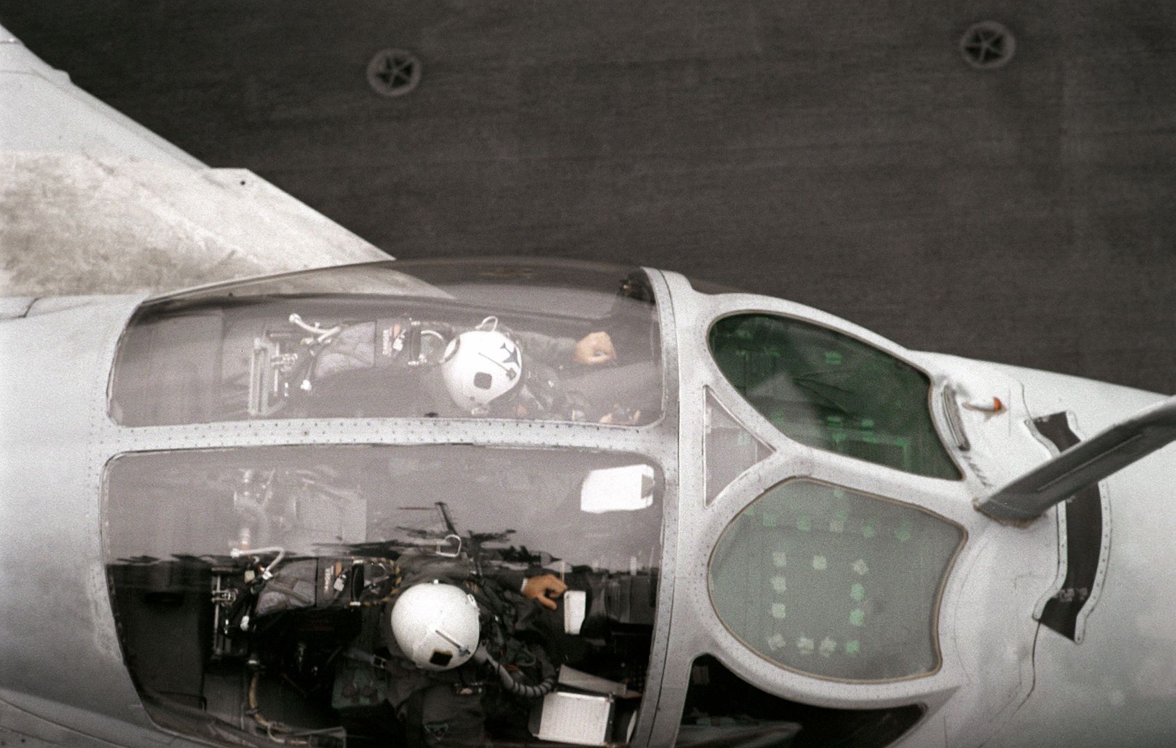 An Overhead View Of The Cockpit Of An A 6E Intruder Aircraft As It Sits On A Catapult On The Flight Deck Of The Aircraft Carrier USS RANGER