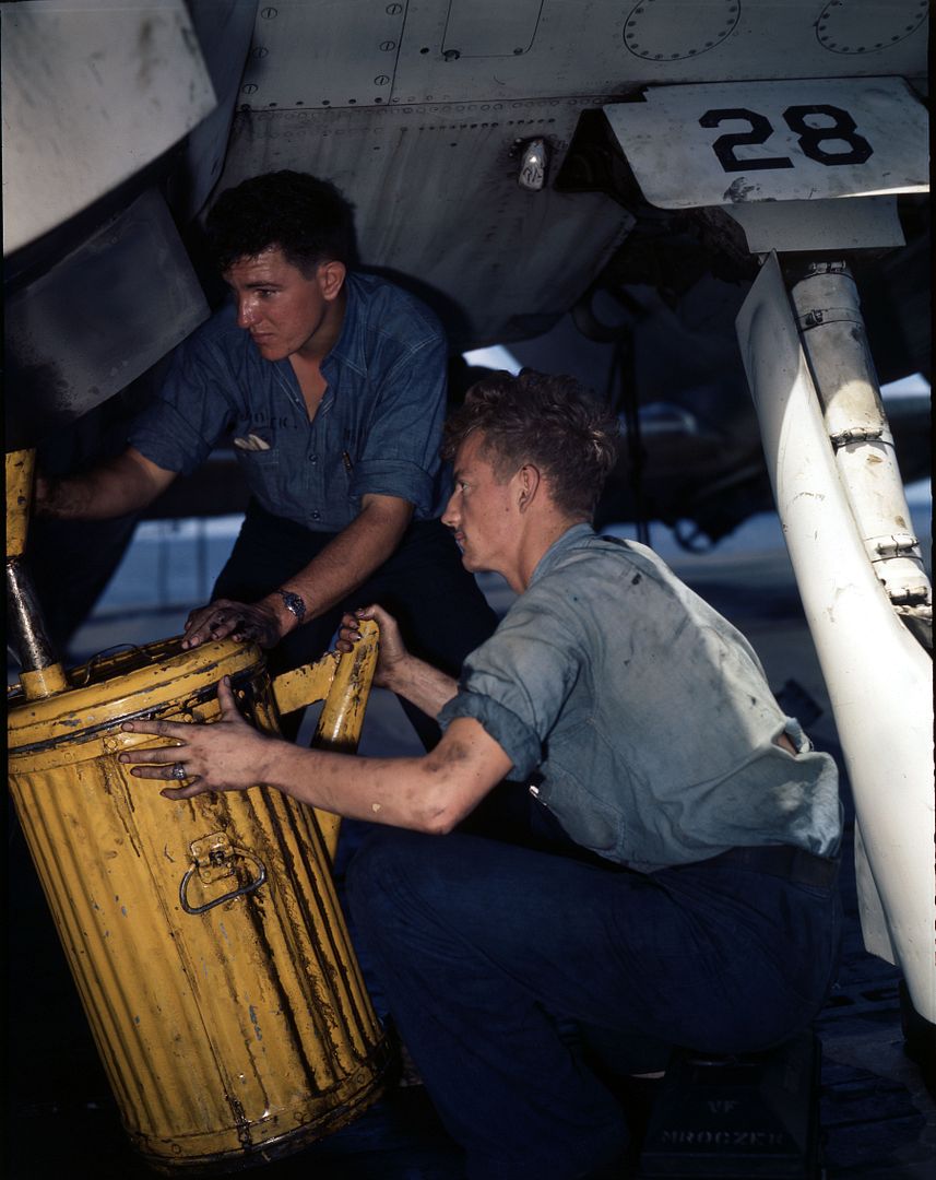 Aviation Mechanics Drain Oil From Engine Of TBF