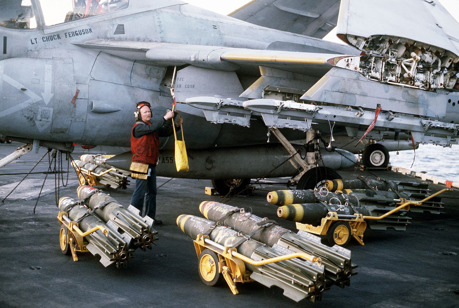 Aviation Ordnancemen Aboard The Aircraft Carrier USS CORAL SEA Load Mark 82 500 Pound Bombs On An Attack Squadron 55 A 6E Intruder Aircraft Prior To An Air Strike On Targets In Libya