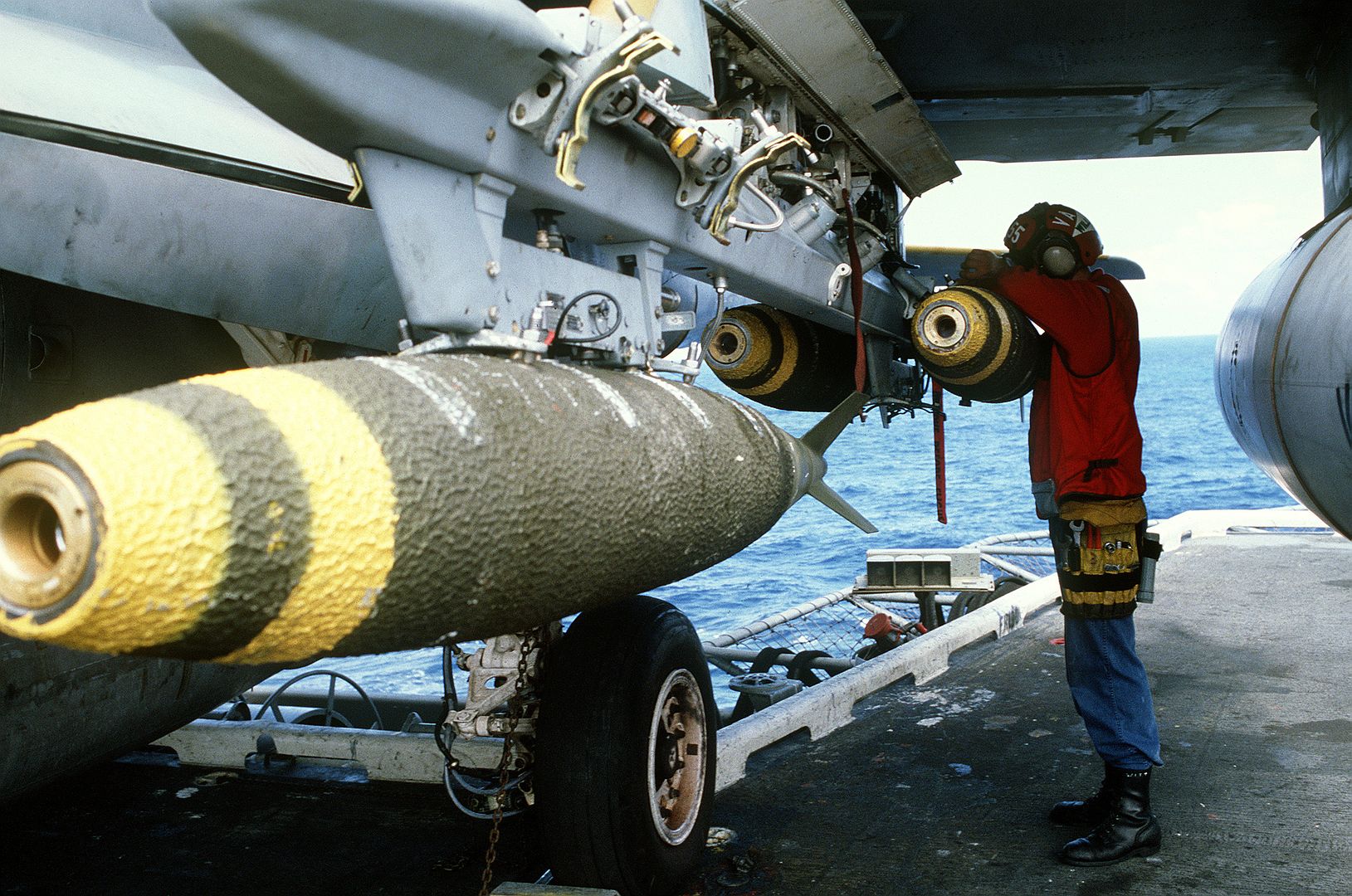 Aviation Ordnancemen Aboard The Aircraft Carrier USS CORAL SEA Load Mark 82 500 Pound Bombs On An Attack Squadron 55 A 6E Intruder Aircraft Prior To An Air Strike On Targets In Libya 1