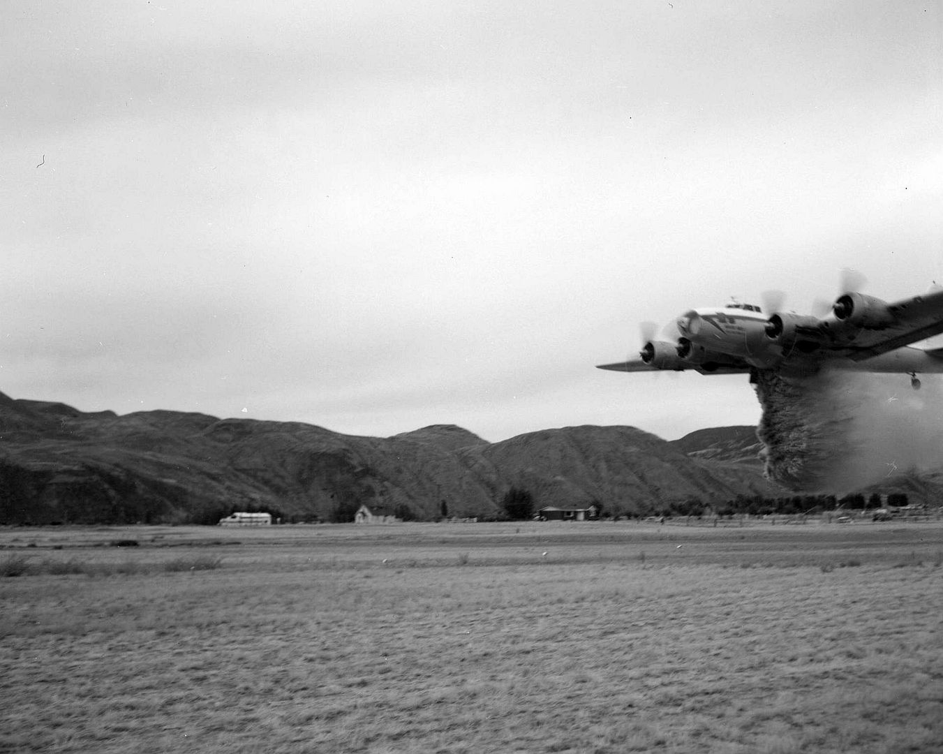 B 17F 70 BO N17W Dropping Water On A Field Near Kamloops