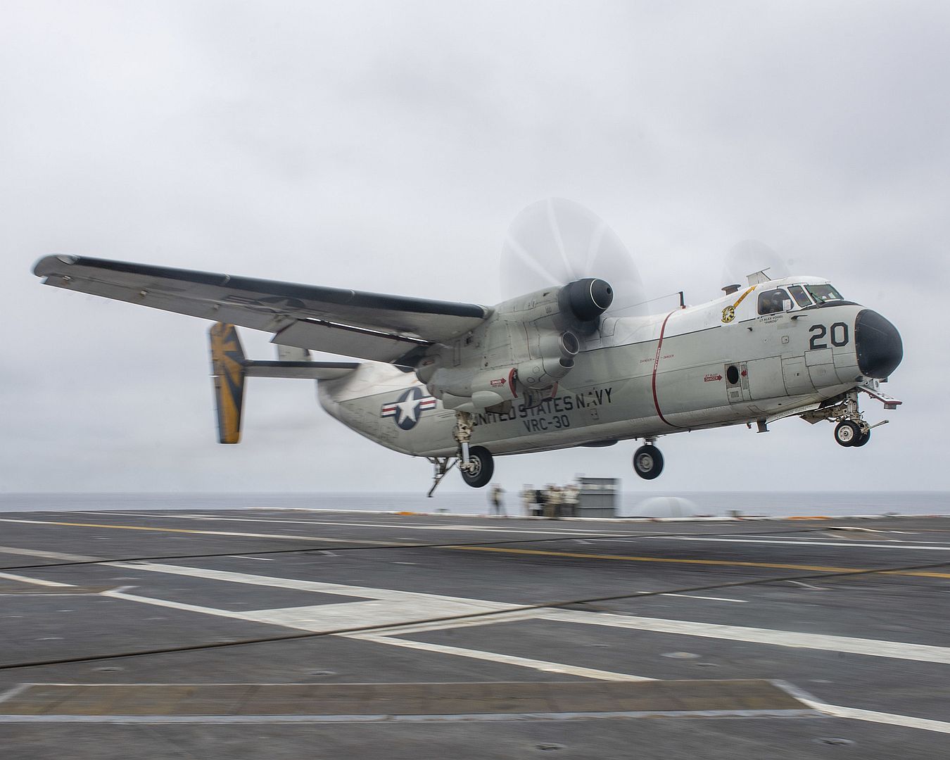 2A Greyhound From The Providers Of Fleet Logistics Support Squadron 30 Prepares To Make An Arrested Gear Landing On The Flight Deck Of The Aircraft Carrier USS Nimitz