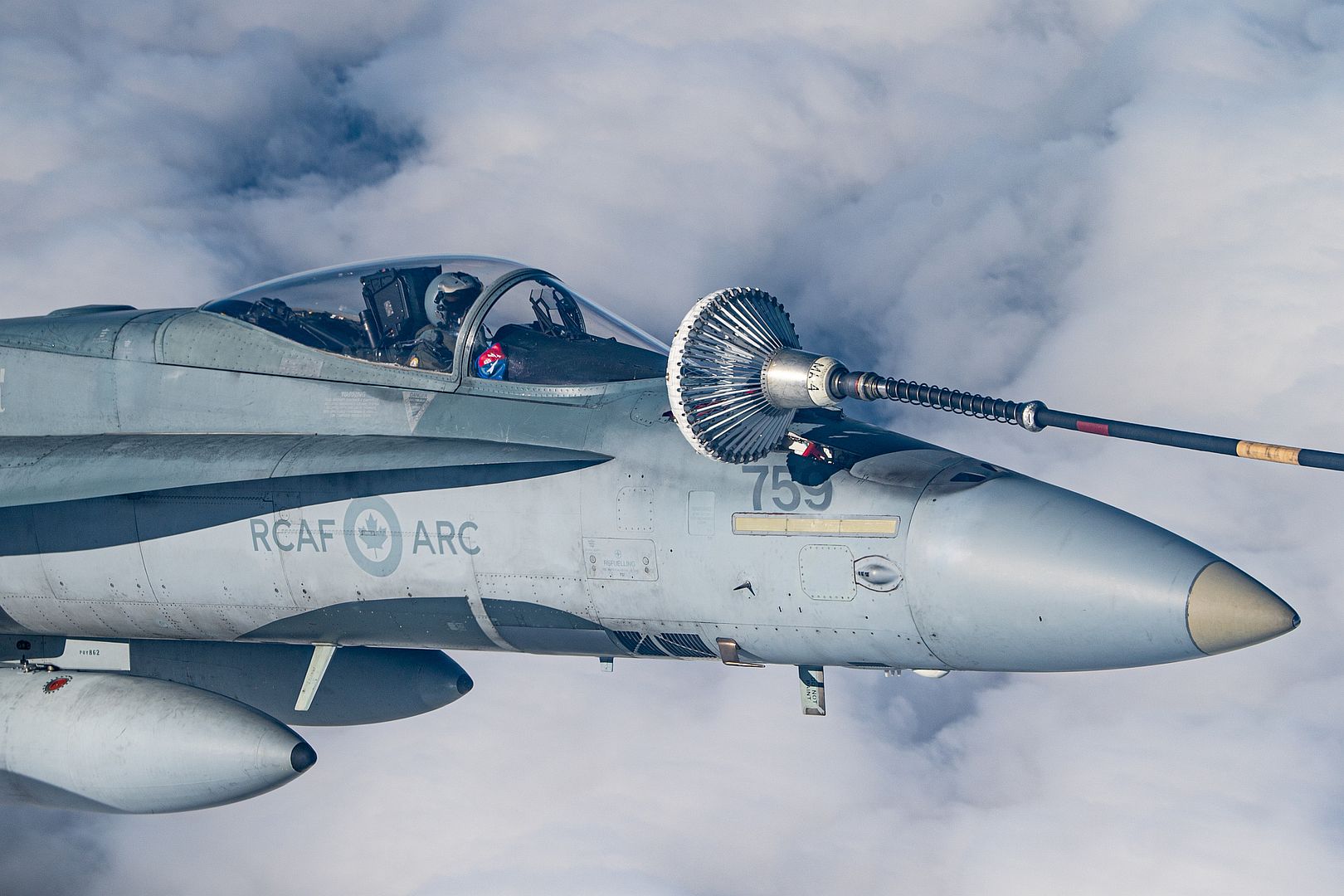 CF 188 Hornet 425 Tactical Fighter Squadron Refuels From A CC 150 Polaris Aircraft