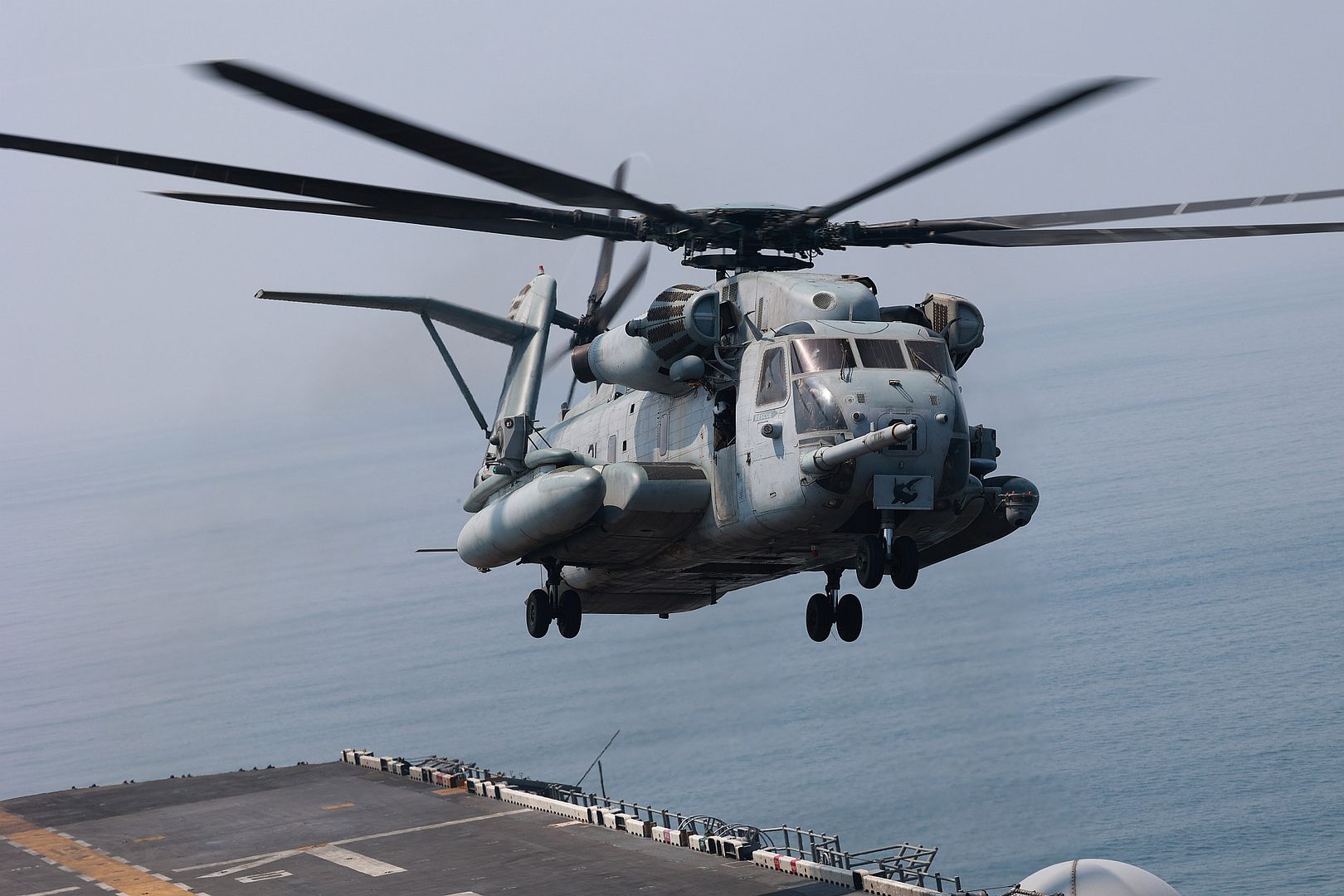53E Super Stallion Helicopter Attached To Marine Medium Tilt Rotor Squadron 162 Takes Off The Flight Deck Of Amphibious Assault Ship USS Bataan