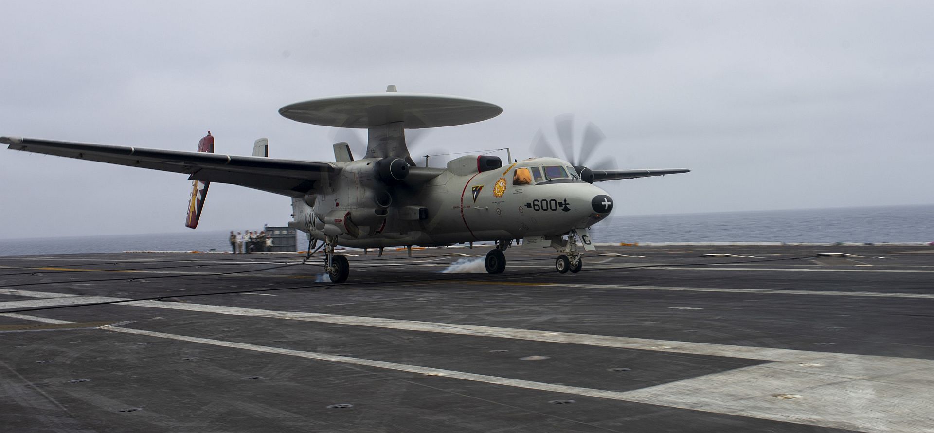 2C Hawkeye From The Sun Kings Of Carrier Airborne Early Warning Squadron 116 Makes An Arrested Gear Landing On The Flight Deck Of The Aircraft Carrier USS Nimitz