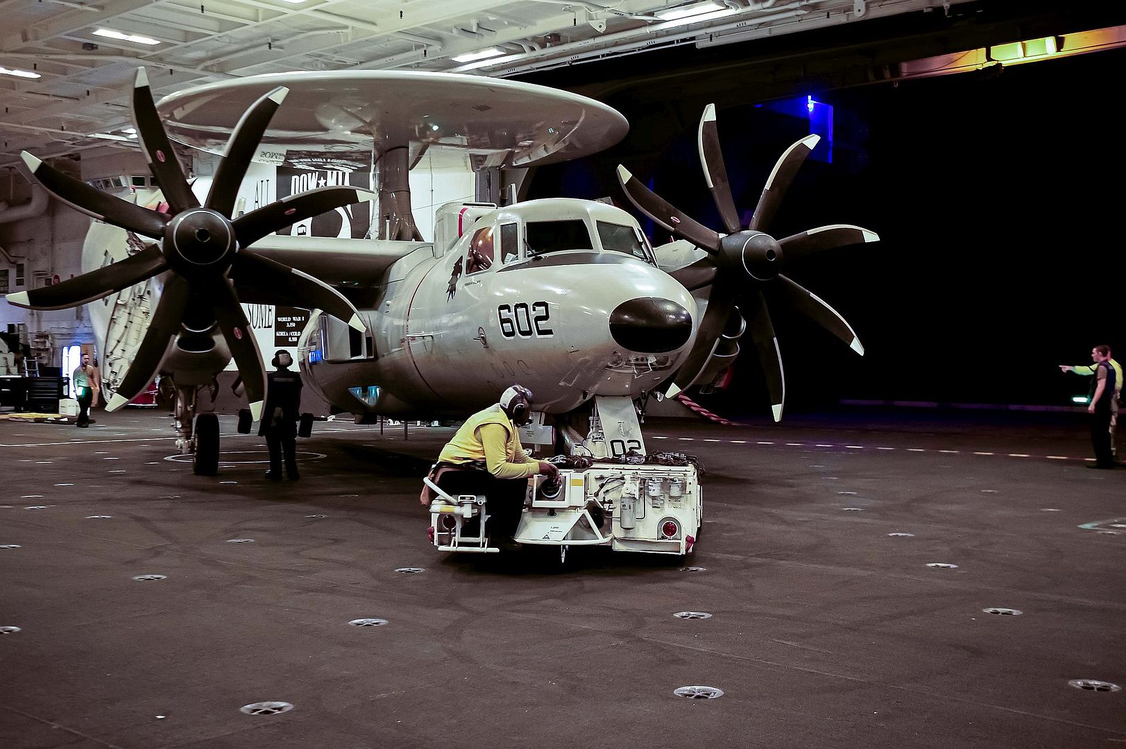 2D Advanced Hawkeye Assigned To The Black Eagles Of Carrier Airborne Early Warning Squadron 113 In The Hangar Bay Of The Aircraft Carrier USS Carl Vinson