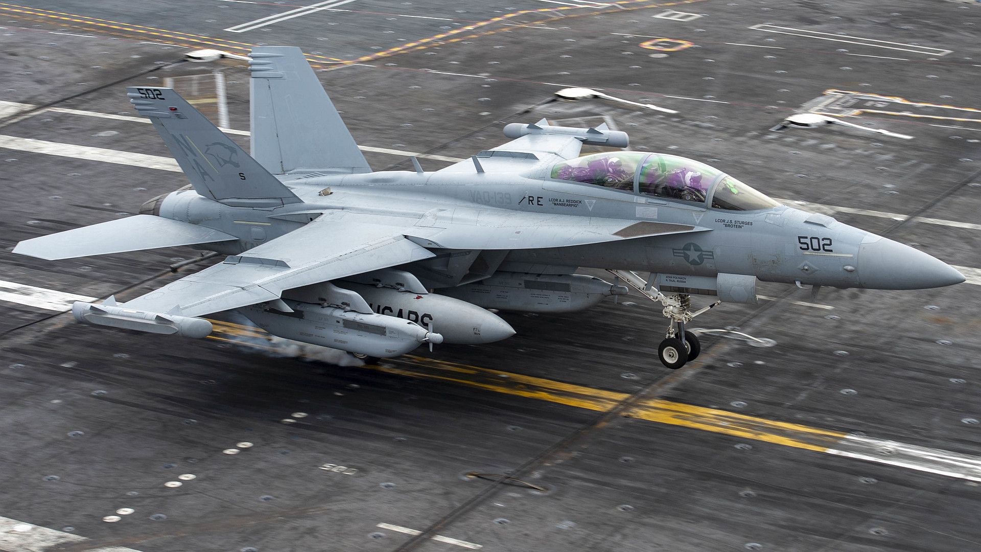 18G Growler From The Cougars Of Electronic Attack Squadron 134 Performs An Arrested Gear Landing On The Flight Deck Aboard The Aircraft Carrier USS Nimitz
