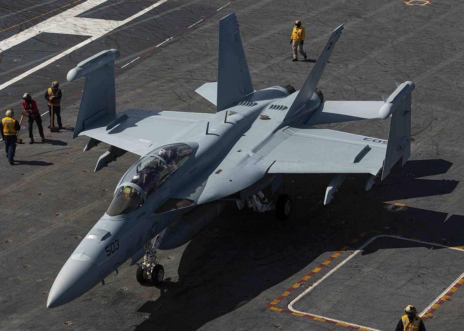 18G Growler From The Vikings Of Electronic Attack Squadron 129 Taxis Across The Flight Deck Of The Aircraft Carrier USS Nimitz