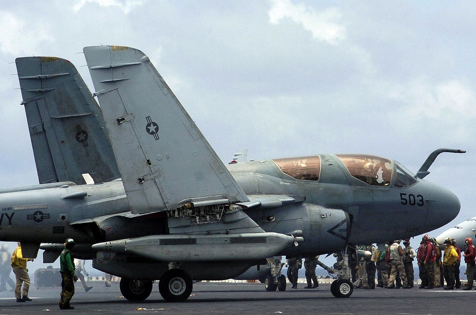 6B Prowler Aircraft From Electronic Attack Squadron 136 Folds Up Its Wings Following Recovery On The Flight Deck Of The Aircraft Carrier USS KITTY HAWK