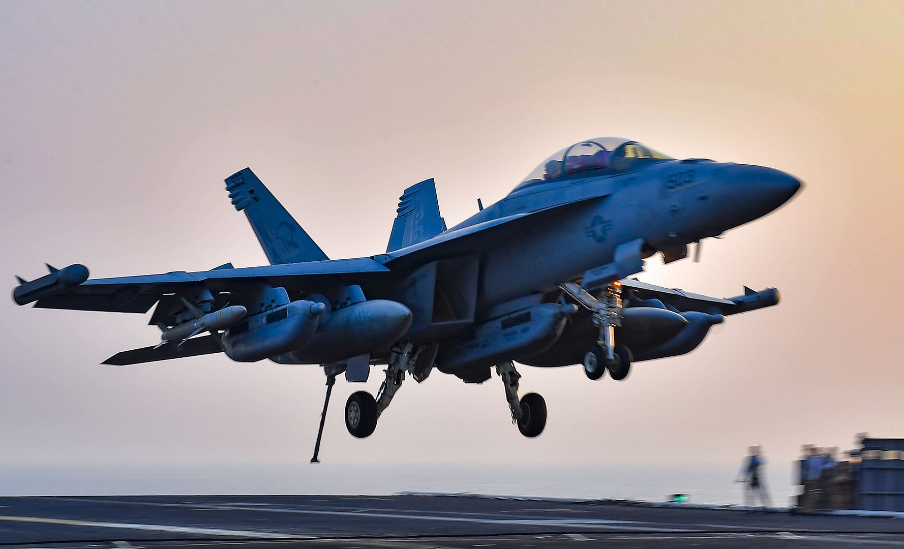 EA 18G Growler From The Cougars Of Electronic Attack Squadron VAQ 139 Makes An Arrested Gear Landing On The Flight Deck Aboard The Aircraft Carrier USS Nimitz