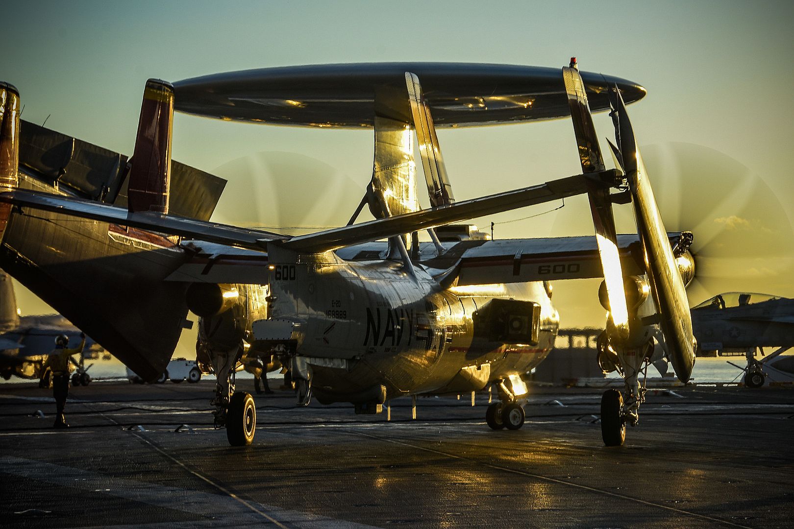 E 2D Hawkeye Attached To The Tiger Tails Of Airborne Command And Control Squadron VAW 125 Moves Into Position On The Flight Deck Of The Navys Only Forward Deployed Aircraft Carrier USS Ronald Reagan