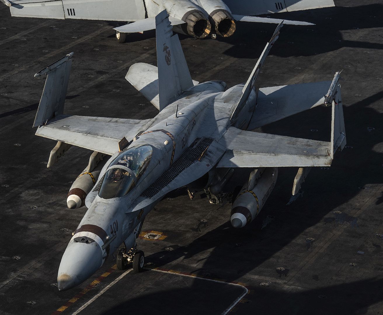 Taxis Across The Flight Deck Of The Aircraft Carrier USS Nimitz Taxis Across The Flight Deck Of The Aircraft Carrier USS Nimitz