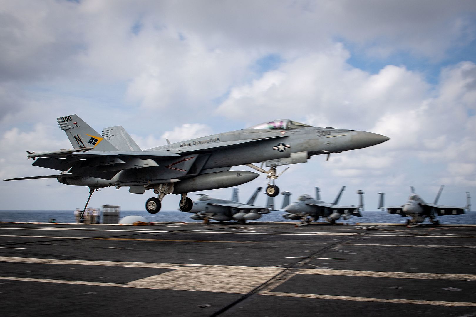 18E Super Hornet Assigned To The Blue Diamonds Of Strike Fighter Squadron VFA 146 Lands On The Flight Deck Of The Aircraft Carrier USS Theodore Roosevelt