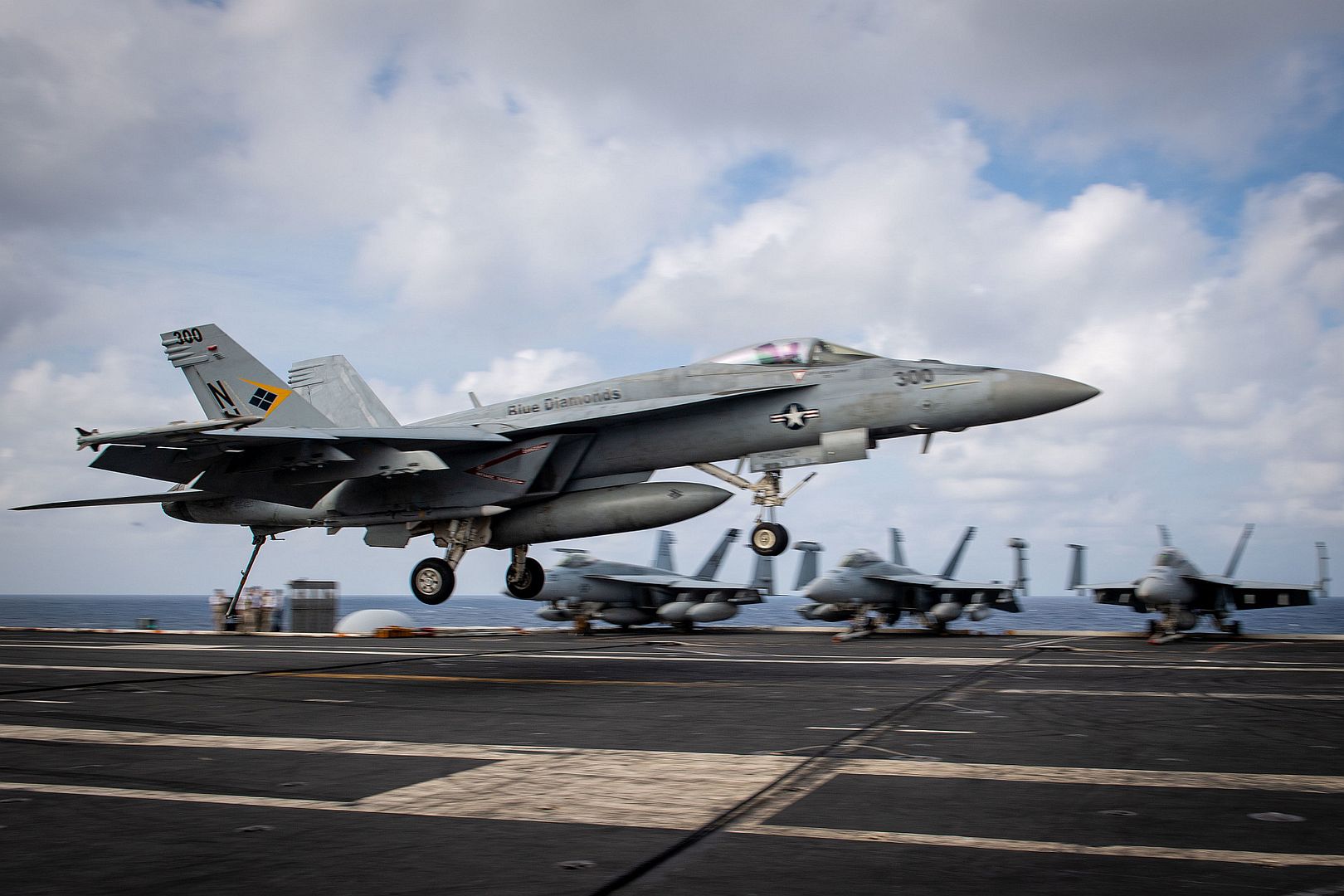 18E Super Hornet Assigned To The Blue Diamonds Of Strike Fighter Squadron VFA 146 Lands On The Flight Deck Of The Aircraft Carrier USS Theodore Roosevelt 18E Super Hornet Assigned To The Blue Diamonds Of Strike Fighter Squadron VFA 146 Lands On The Flight Deck Of The Aircraft Carrier USS Theodore Roosevelt