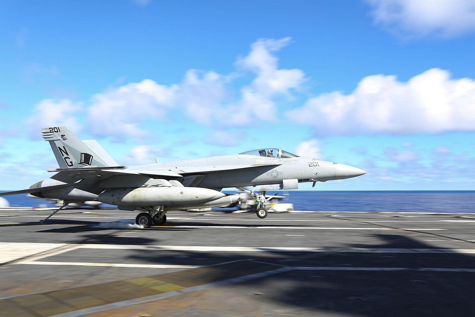 18E Super Hornet Assigned To The Tophatters Of Strike Fighter Squadron VFA 14 Lands On The Flight Deck Of USS Abraham Lincoln