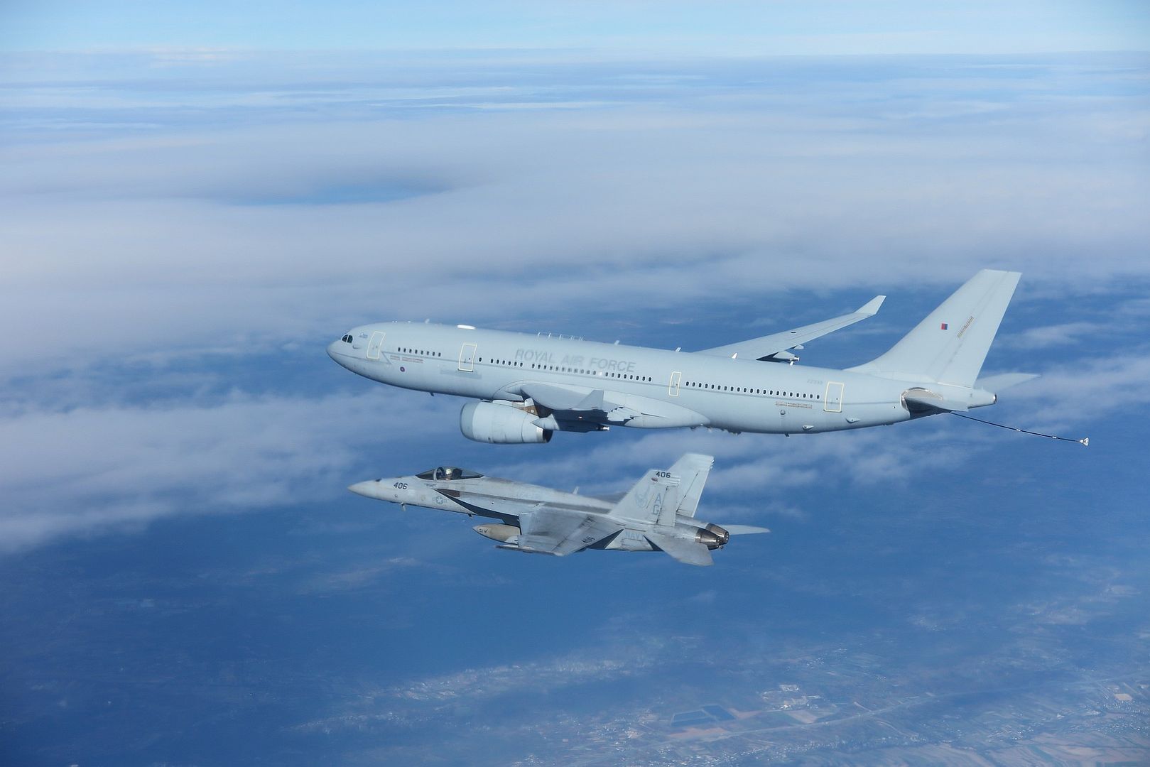 18E Super Hornet Attached To Strike Fighter Squadron 136 Flies Alongside A British Voyager Tanker 