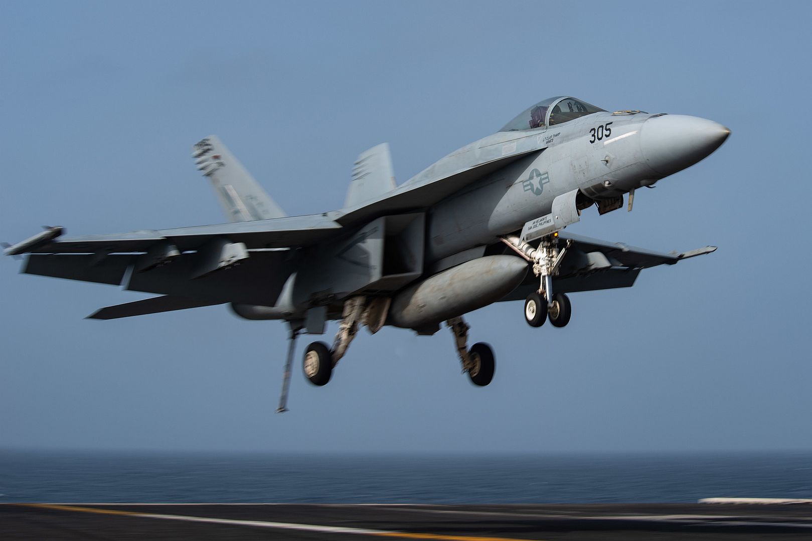 18E Super Hornet Fighter Jet Attached To The Eagles Of Strike Fighter Squadron 115 Lands On The Flight Deck Of Aircraft Carrier USS Ronald Reagan