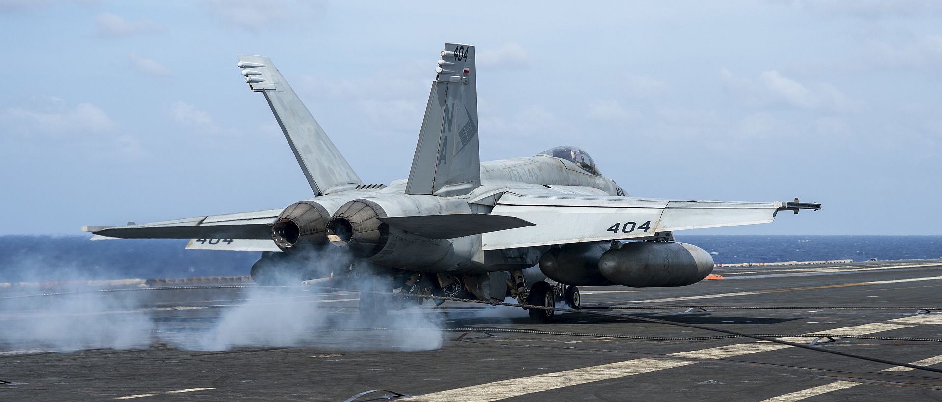 18E Super Hornet From The Blue Diamonds Of Strike Fighter Squadron 146 Makes An Arrested Landing On The Aircraft Carrier USS Nimitz
