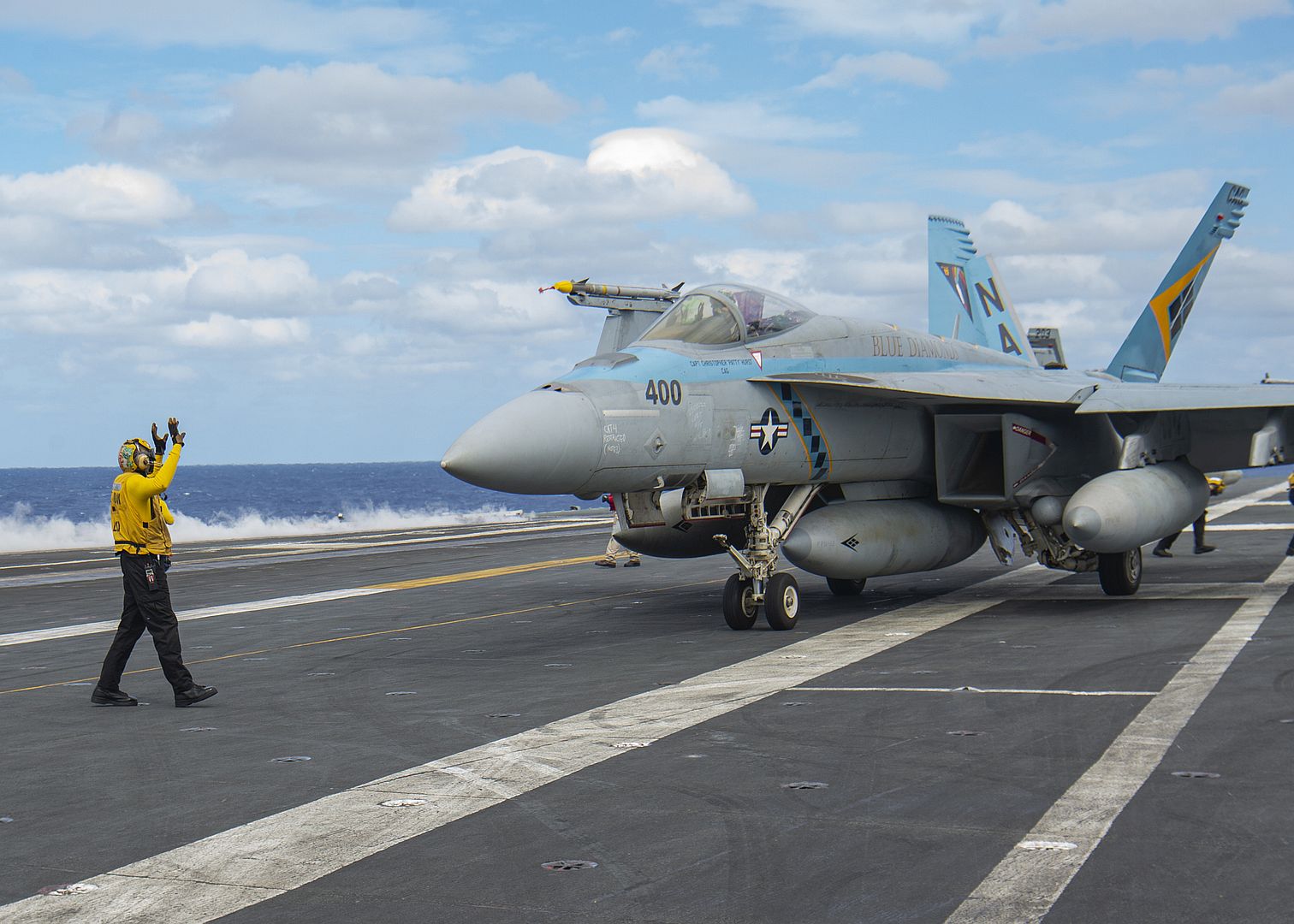 18E Super Hornet From The Blue Diamonds Of Strike Fighter Squadron 146 Taxis Across The Flight Deck Of The Aircraft Carrier USS Nimitz