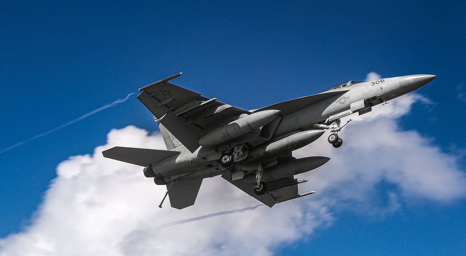 18E Super Hornet From The Kestrels Of Strike Fighter Squadron 137 Flies Over The Aircraft Carrier USS Nimitz