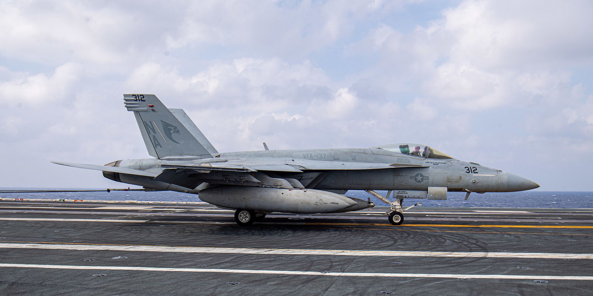 18E Super Hornet From The Kestrels Of Strike Fighter Squadron 137 Makes An Arrested Landing On The Aircraft Carrier USS Nimitz
